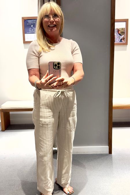 I love beige and white together! The wide leg, linen blend pants are perfect for summer! Add a white jean jacket and taupe sandals to complete the outfit. Top and pants are under $50 combined! Spring Outfit, Travel Outfit 

#LTKover40 #LTKSeasonal #LTKtravel