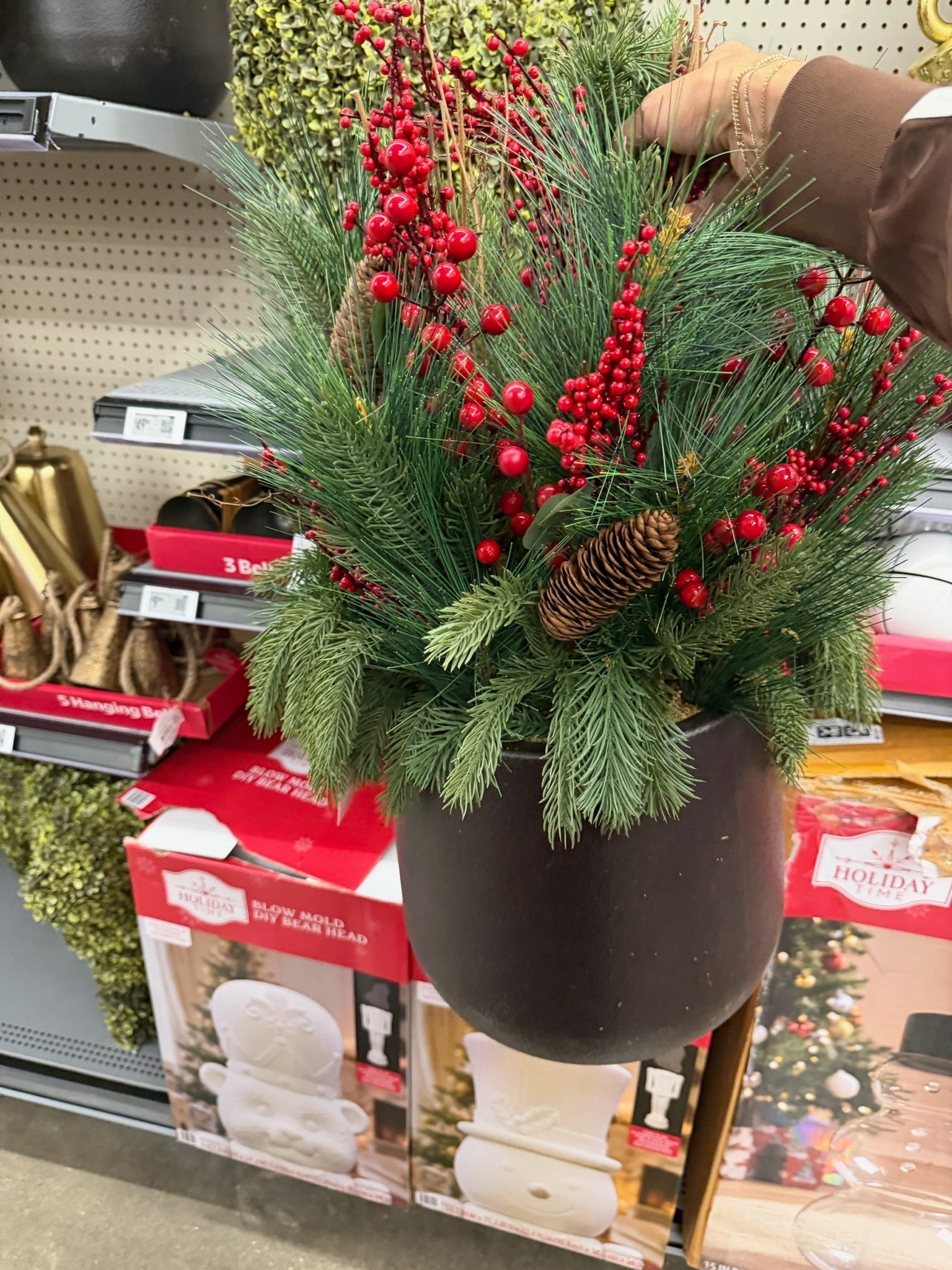 This Christmas greenery arrangement is such a beautiful way to decorate an entryway or front porch for the holidays. I love the mix of pine, red berries, and pinecones for a classic seasonal look that already feels full and finished.

Christmas greenery, holiday arrangement, red berry decor, pinecone decor, Christmas porch decor, holiday entryway, seasonal greenery, Christmas home decor, themominstyle

#LTKSeasonal #LTKHome #LTKdayinmylife