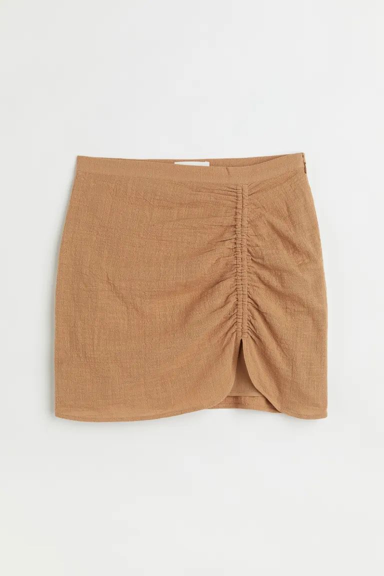Conscious choice  New ArrivalShort skirt in a cotton crêpe weave. Regular waist with a concealed... | H&M (US + CA)