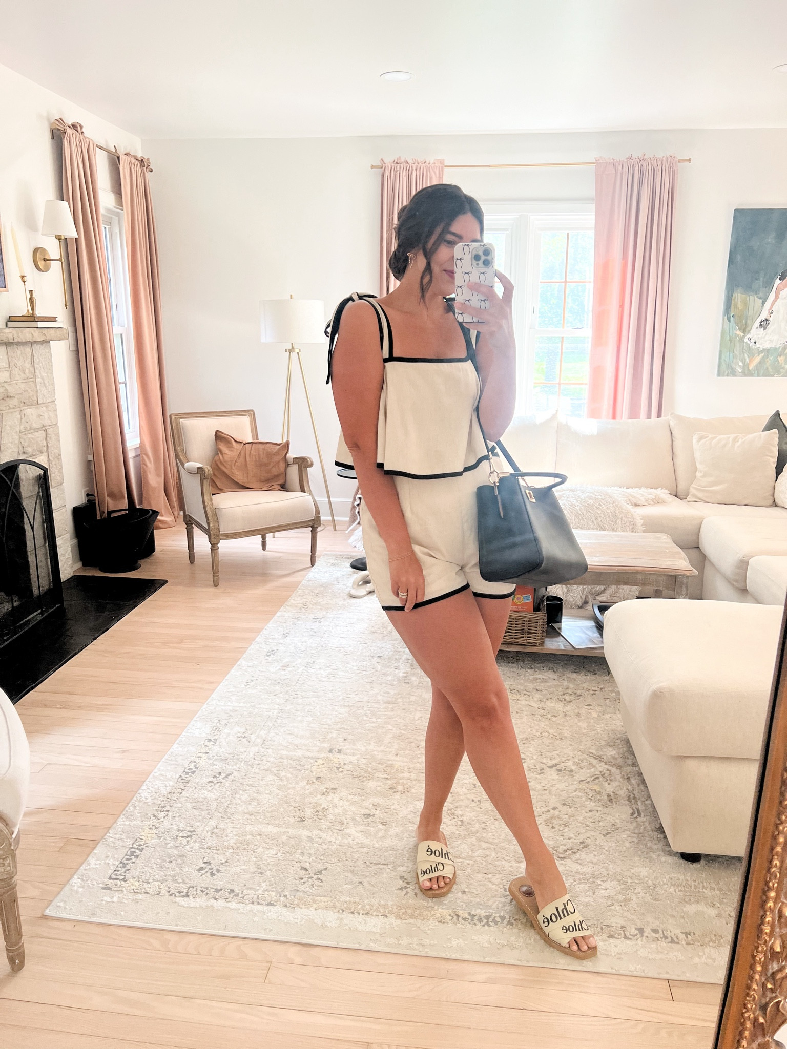 Cream & black womens romper, bow earrings and black crossbody bag. What to wear in the summer or to work 

#LTKSeasonal #LTKWorkwear #LTKItBag