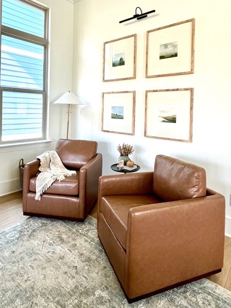 These faux leather swivel chairs from CHITA living are 10/10 comfy! They are perfect in this cozy corner with my burl wood gallery frames! 

#LTKfamily #LTKhome #LTKstyletip