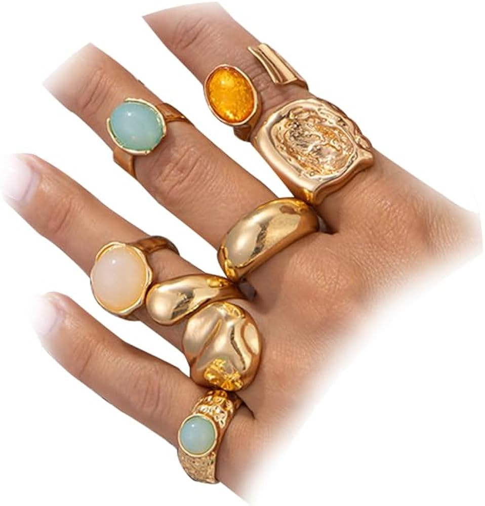 The stacked ring set consists of seven or six different styles of rings, paired with colored ston... | Amazon (US)