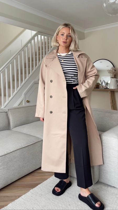 A classic and timeless transitional look. 
I wear size S in camel trench coat, size 10 in black tailored trousers and size S in stripe top  