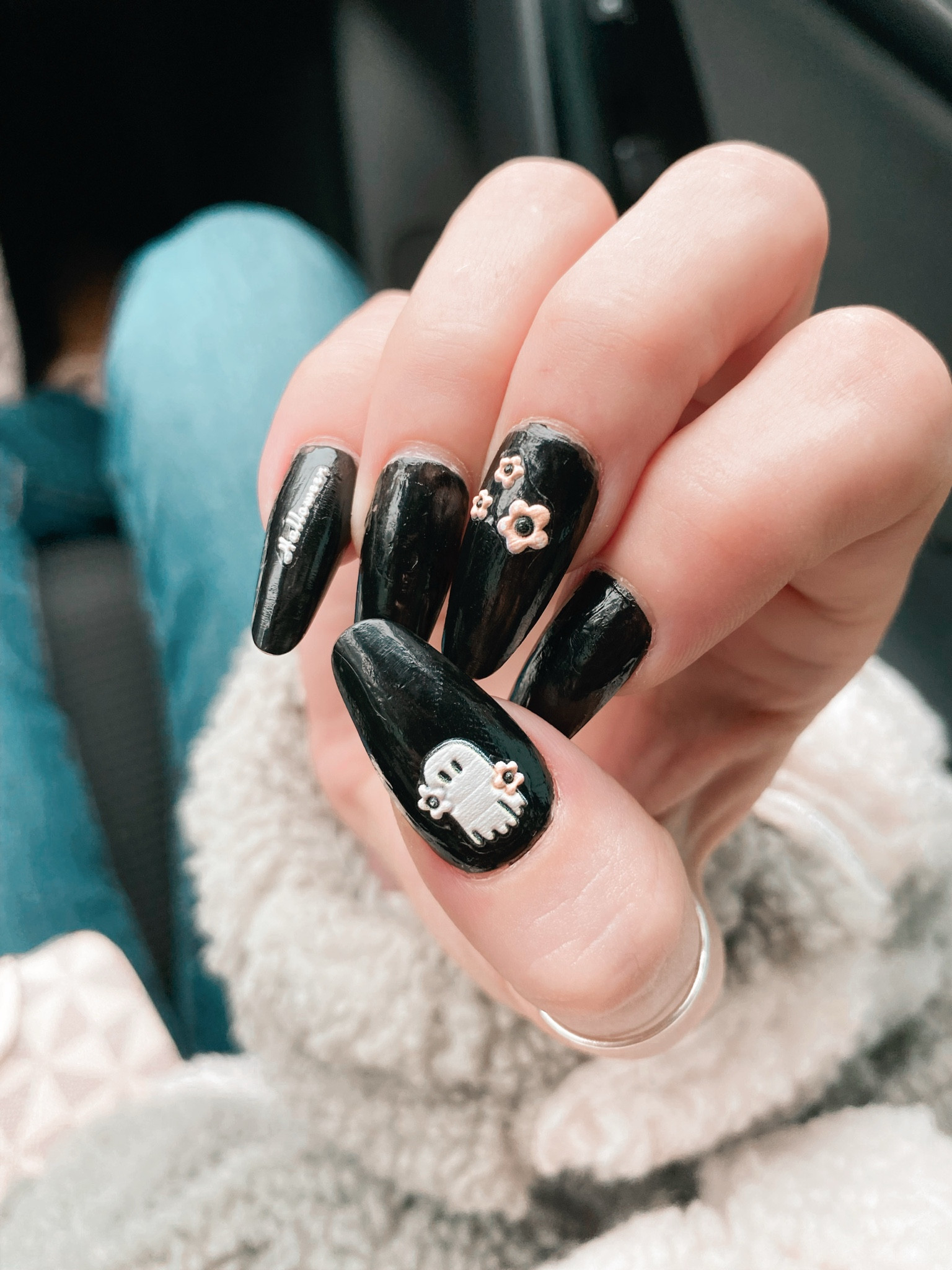 Spooky season, but make it cute! 👻🖤 

Loving these Halloween nails with ghostly vibes and floral accents. #NailArt #SpookyCute #HalloweenNails 

#LTKStyleTip #LTKHoliday #LTKHalloween
