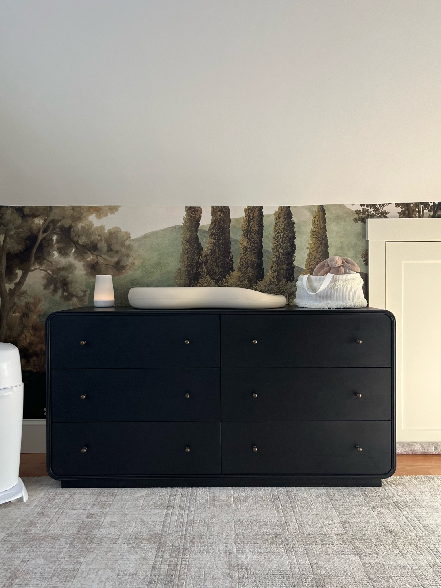 The dresser of my dreams ☁️✨ This beauty is HEAVY & timeless & will absolutely last a lifetime. I’m not gonna lie… I searched for almost a year for dupes & there is NOTHING exactly like this piece. It is 100% worth the splurge. My nursery credit card bill is none of my business 💸

Dresser nursery, dresser changing table, nursery bureau, nursery long dresser, baby dresser, baby clothing storage, Black long dresser, Wilkins dresser, McGee and co Wilkins dresser, McGee & co Wilkins dresser, black curved dresser, dresser curved sides, black dresser brass knobs, black dresser gold knobs, 6 drawer dresser black, black wood dresser, nursery wallpaper, meadow wallpaper, woodsy wallpaper, plaid rug nursery, nursery sloped ceiling, nursery angled ceiling 

#LTKBaby #LTKHome