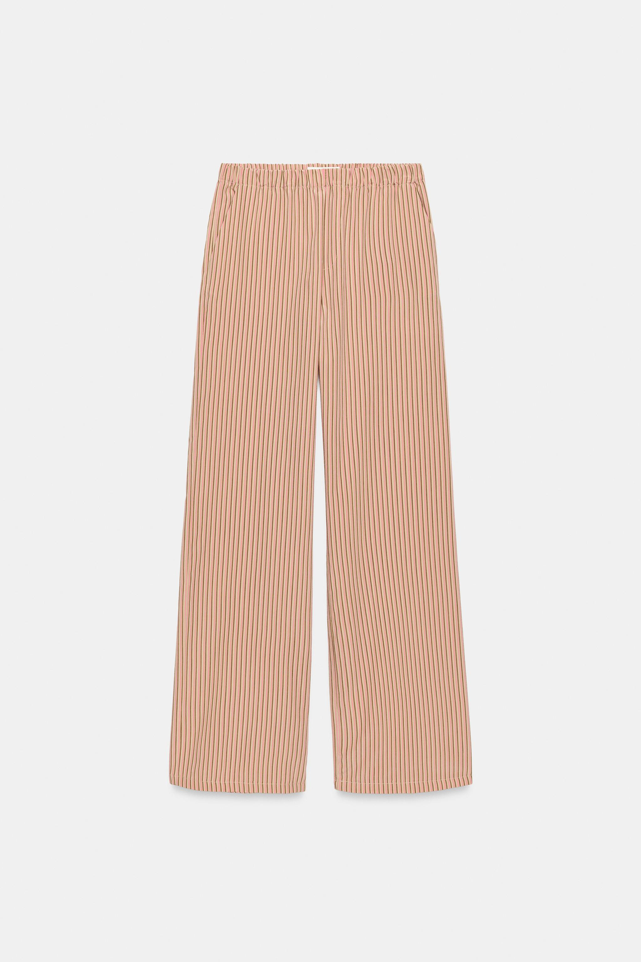 Model height: 181 cmMid-waist trousers with an elasticated waistband and side pockets. | Zara UK