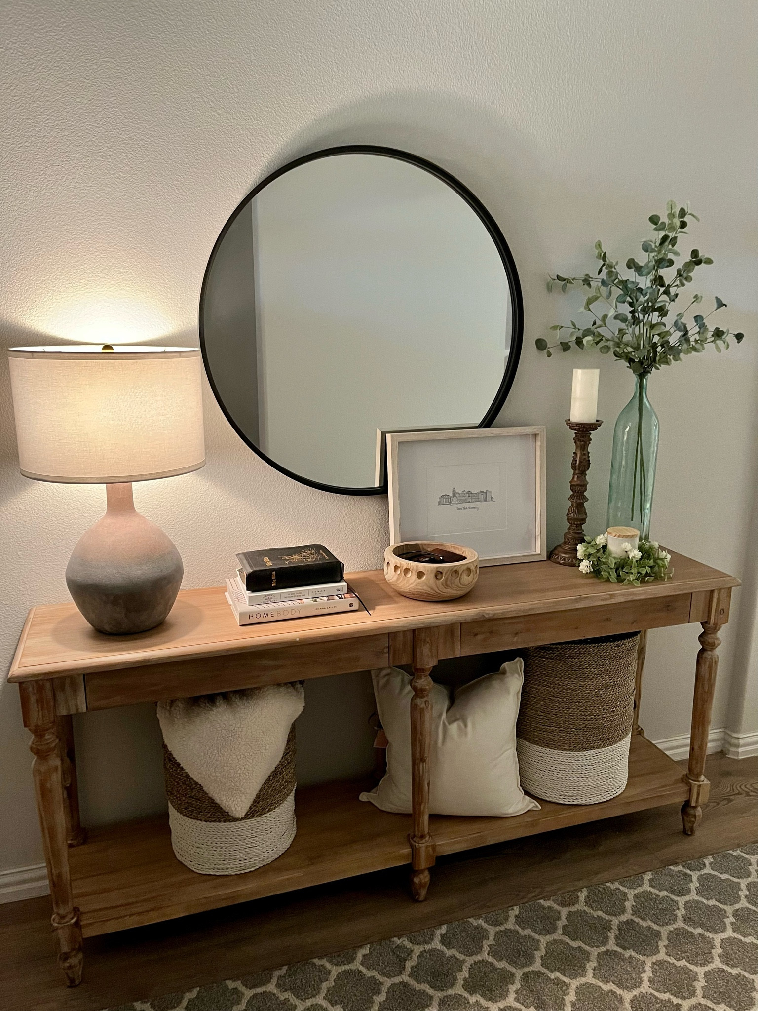 Cozy entryway table. World market Everett foyer table, Target Style mirror, Homegoods finds: lamp, baskets, picture frame, Antique finds: Bible, candle stick