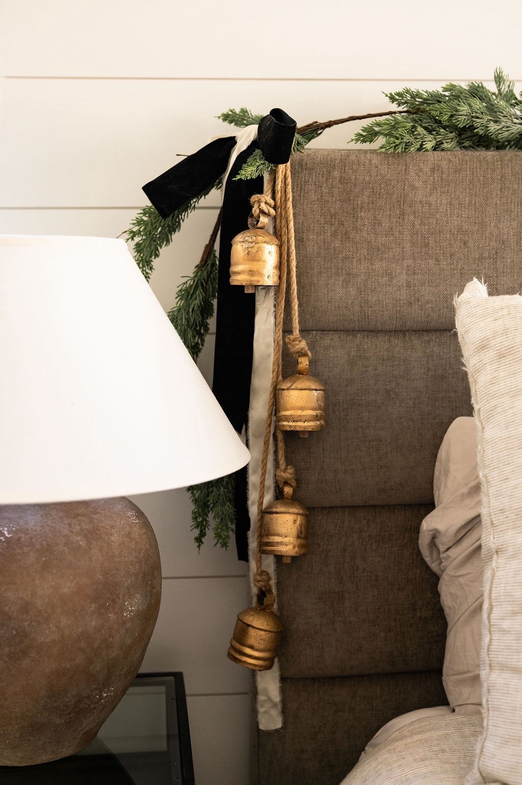 The sweetest little touch of Christmas in the bedroom 🤍✨ Loving the mix of gold holiday bells, cedar garland, and velvet ribbon for a soft, cozy look. Perfect inspo for neutral Christmas bedroom decor, holiday bedroom styling, modern classic Christmas touches, and LTK winter home finds. ✨🌲

#LTKHoliday #LTKSeasonal #LTKHome