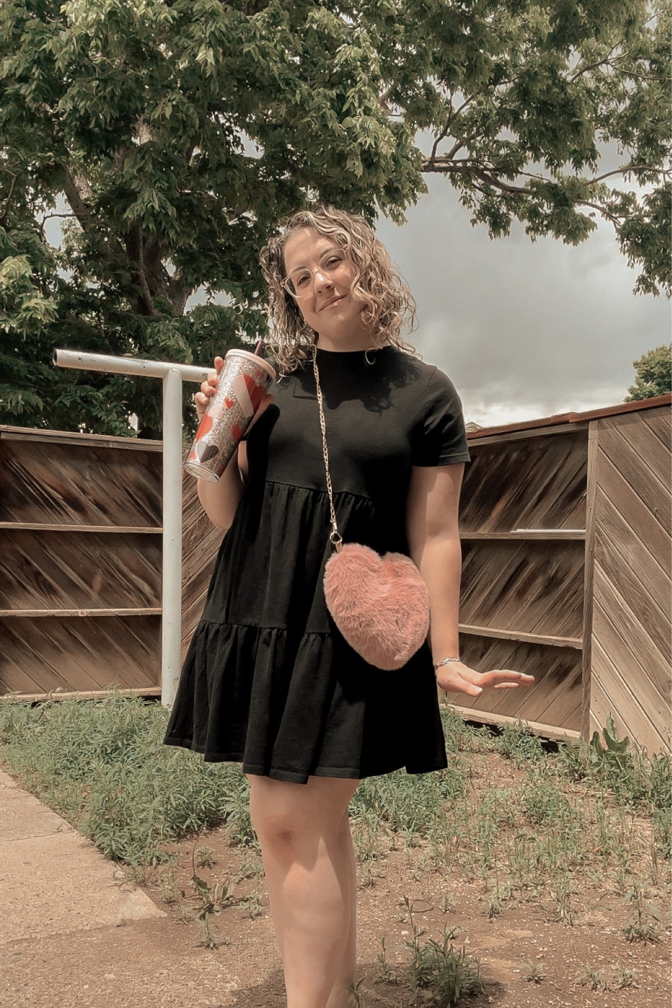 Old Navy Tiered Tee Shirt Dress in Black paired with pink heart accessories 

#LTKsalealert #LTKstyletip #LTKcurves