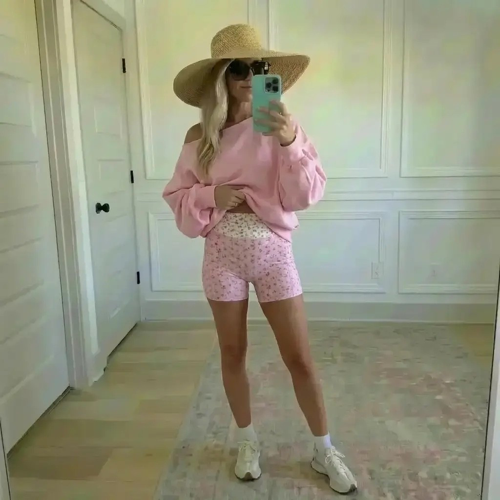 Golden daylight fills a quiet room as she pauses for a mirror moment, wrapped in soft blush tones that feel warm, feminine, and effortlessly chic. A slouchy pink sweatshirt slips off one shoulder, paired with delicate floral bike shorts that hug just right. Finished with classic sneakers, oversized sunglasses, and a wide-brim straw hat, the look feels like spring leisure at its best—equal parts cozy, confident, and ready for sunshine. It’s an outfit made for slow mornings, coffee runs, and pretending you’re on vacation even when you’re not.

Hashtags 🌸☀️

#TrendyHeidi
#TrendyWithAPassport
#SpringStyle
#AthleisureWear
#CasualChic
#SoftPink
#FloralDetails
#EverydayOutfit
#WeekendVibes
#CozyAndCool
#OOTD
#StyleInspo
#EffortlessFashion
#LaidBackLuxury
#SneakerStyle
#MirrorOutfit
#LifestyleBlogger
#SpringOutfits
#ComfortMeetsStyle
#NeutralAesthetic
#WomensStyle
#ActivewearLook
#SunHatStyle
#PinkPalette
#ModernCasual

#LTKgrwm #LTKdayinmylife #LTKValentine