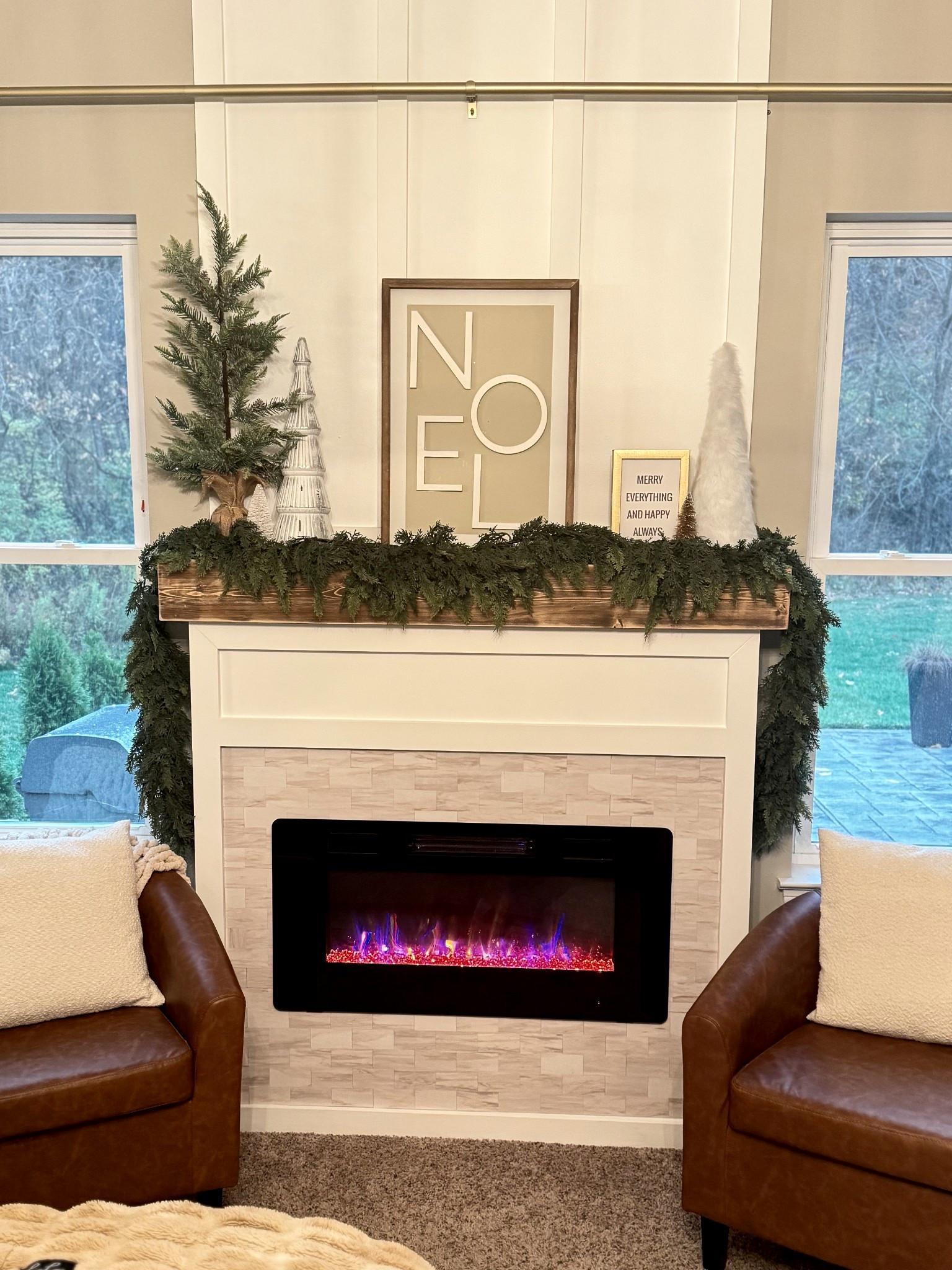 We added a fireplace in our bedroom between two windows. Amazon fireplace insert with built-in around it.

#LTKHoliday #LTKHome #LTKSeasonal