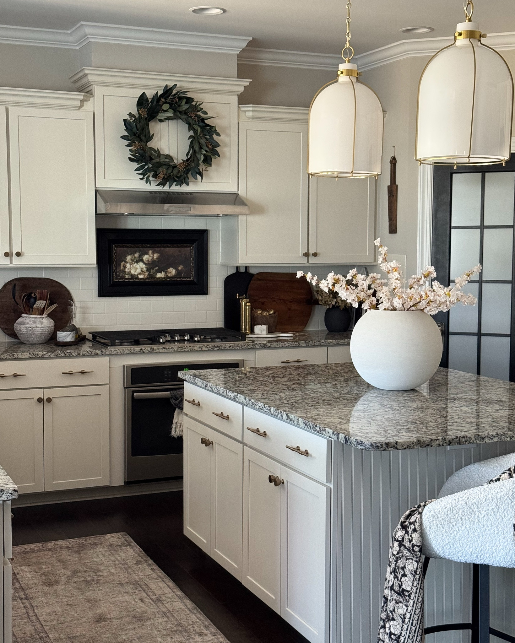Kitchen and Dining Room Lately!!

Island pendants, counter stools, floral throw, runner, cherry blossoms, wreath, brass salt & pepper mills, antique gold faucet, moody hydrangeas, champagne bronze hardware, vintage brass skimmers, greenery, linear chandelier, dining chairs, gold urn, vintage cutting board