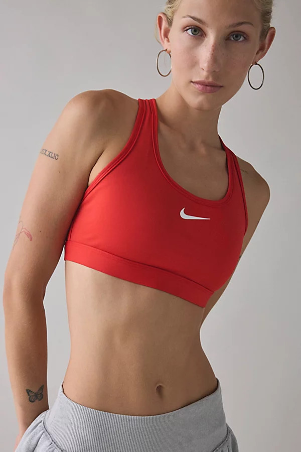 Nike Swoosh Medium Support Sports Bra in University Red, Women's at Urban Outfitters | Urban Outfitters (US and RoW)