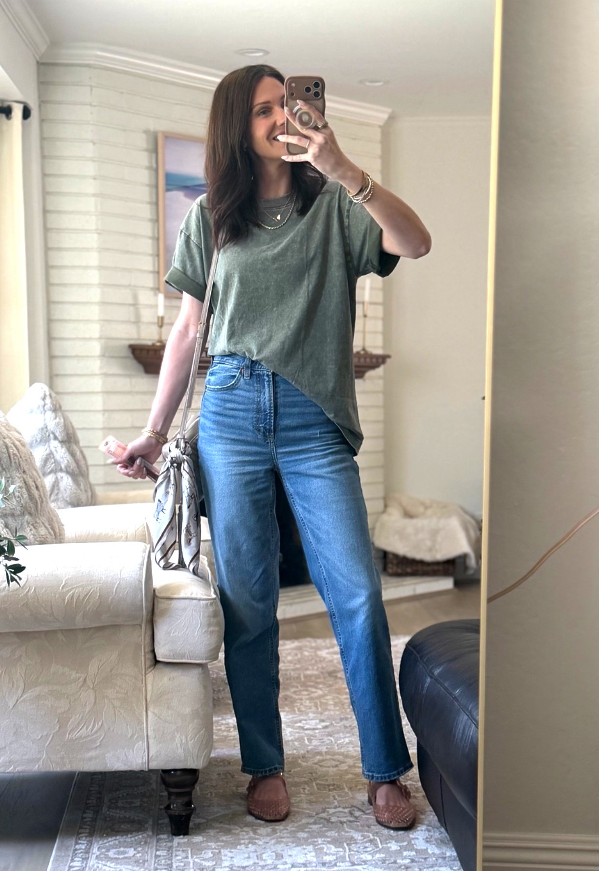 An easy way to style out a long tee-shirt. Roll the sleeves and tuck asymmetrically. I love the vintage wash of this one. I also have it in brown. Also, these jelly shoes are so comfortable!

#LTKootd #LTKmomlife #LTKSaleAlert