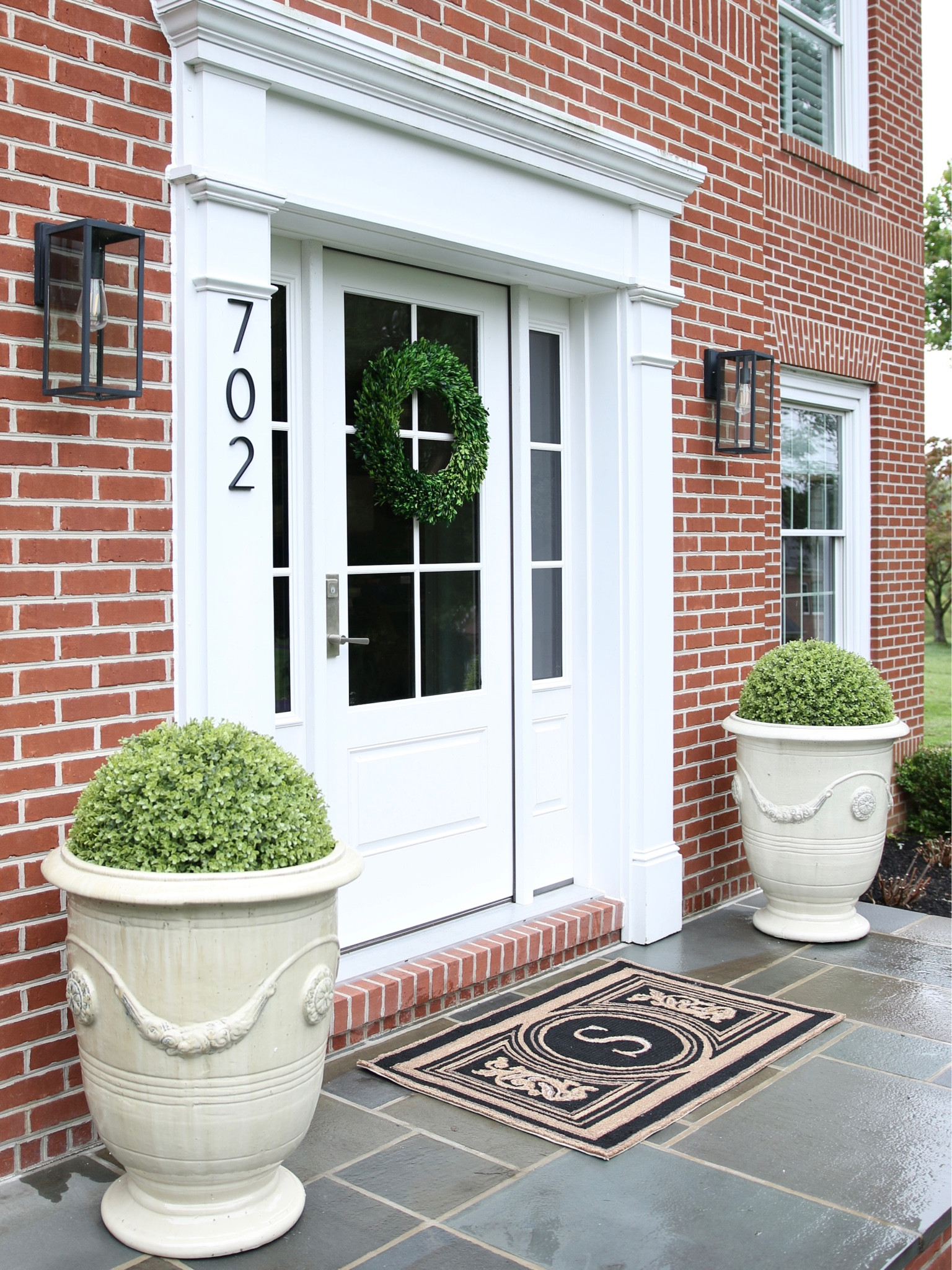 Statement making terracotta planters paired with realistic faux boxwoods. Add a monogram mat for a classic front door display.

@Frontgate #Frontfage #add

#LTKhome #LTKSeasonal #LTKstyletip