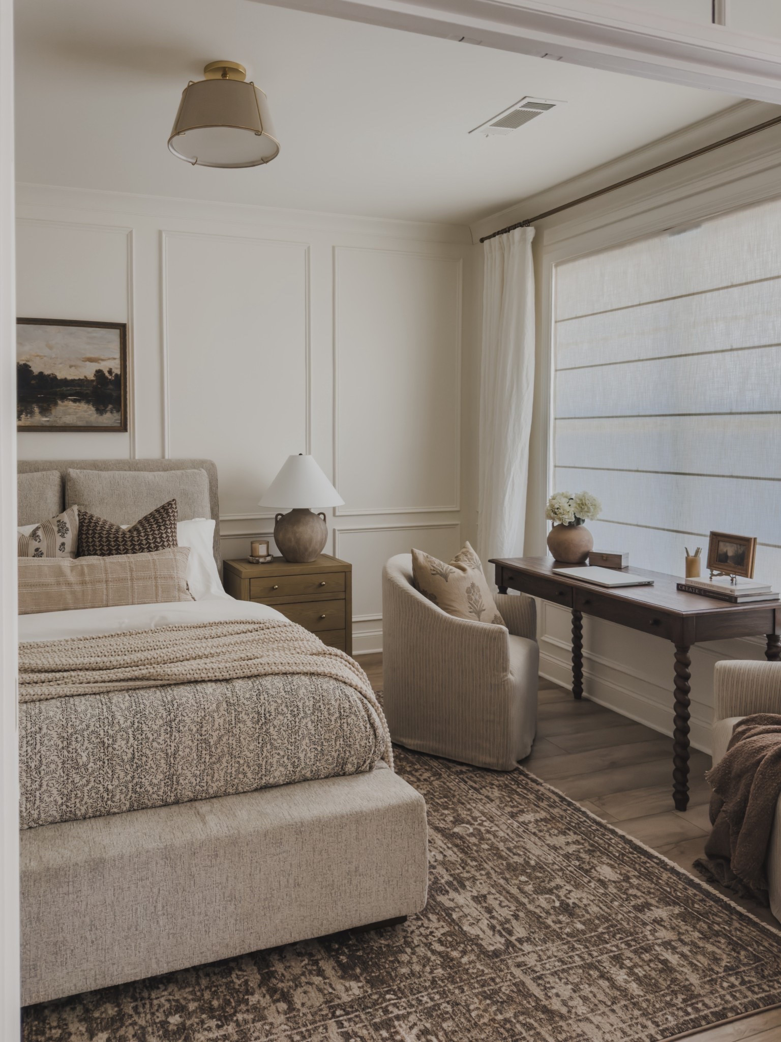 Refreshing my guest room inspired with a collected and timeless style. Simply swaps like my earthy toned rug, updated lighting, and a few throw pillows tie the entire room together for a classic vibe. 

Home finds, neutral home inspo, guest bedroom refresh, furniture favorites, neutral wood tones, moody area rug, upholstered bed frame, office desk, linen curtain, roman shades, accent chair, collected style, wainscoting detail, lighting detail, nightstand favorites, table lamp, layered bedding, cozy throw pillow, faux florals, Wayfair, Loloi, Kathy Kuo home, pottery barn style, Etsy, Target style, TwoPages, found it on Amazon, Rejuvenation, Ashley Furniture, shop the look!

#LTKSeasonal #LTKHome