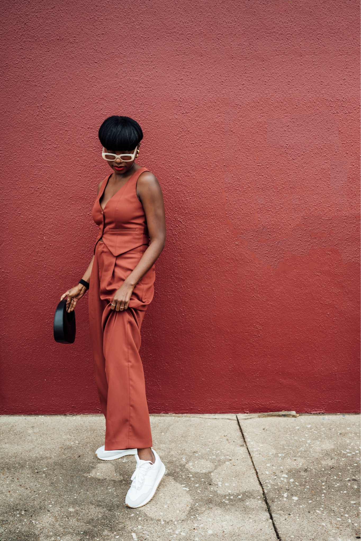 Doing outfit! Rust vest and pant combo paired with white New Balance 237 and black mini Luna bag by Anine Bing  

#LTKFind #LTKworkwear #LTKshoecrush