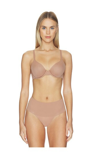 SPANX Supersmooth Brava Lightly Lined Bra in Brown. - size 36B | Revolve Clothing (Global)