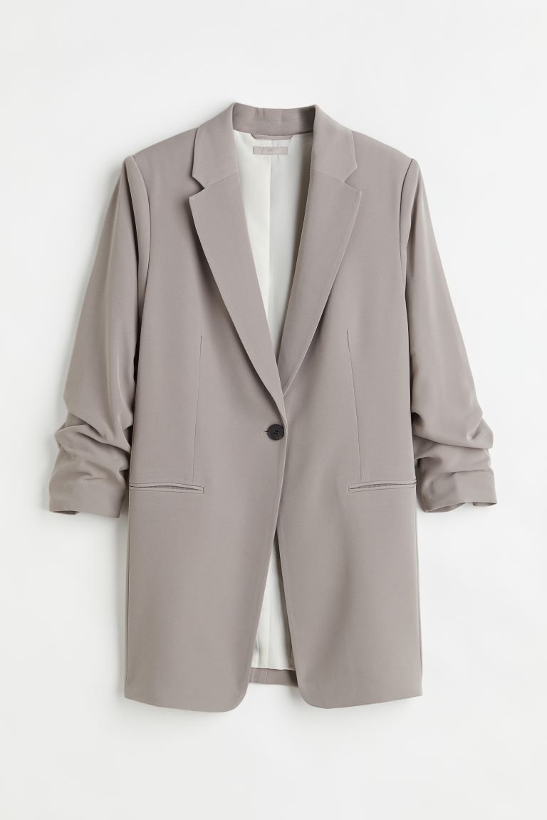 Conscious choice  New ArrivalStraight-cut, loose-fit jacket in woven fabric. Notched lapels, one ... | H&M (US + CA)