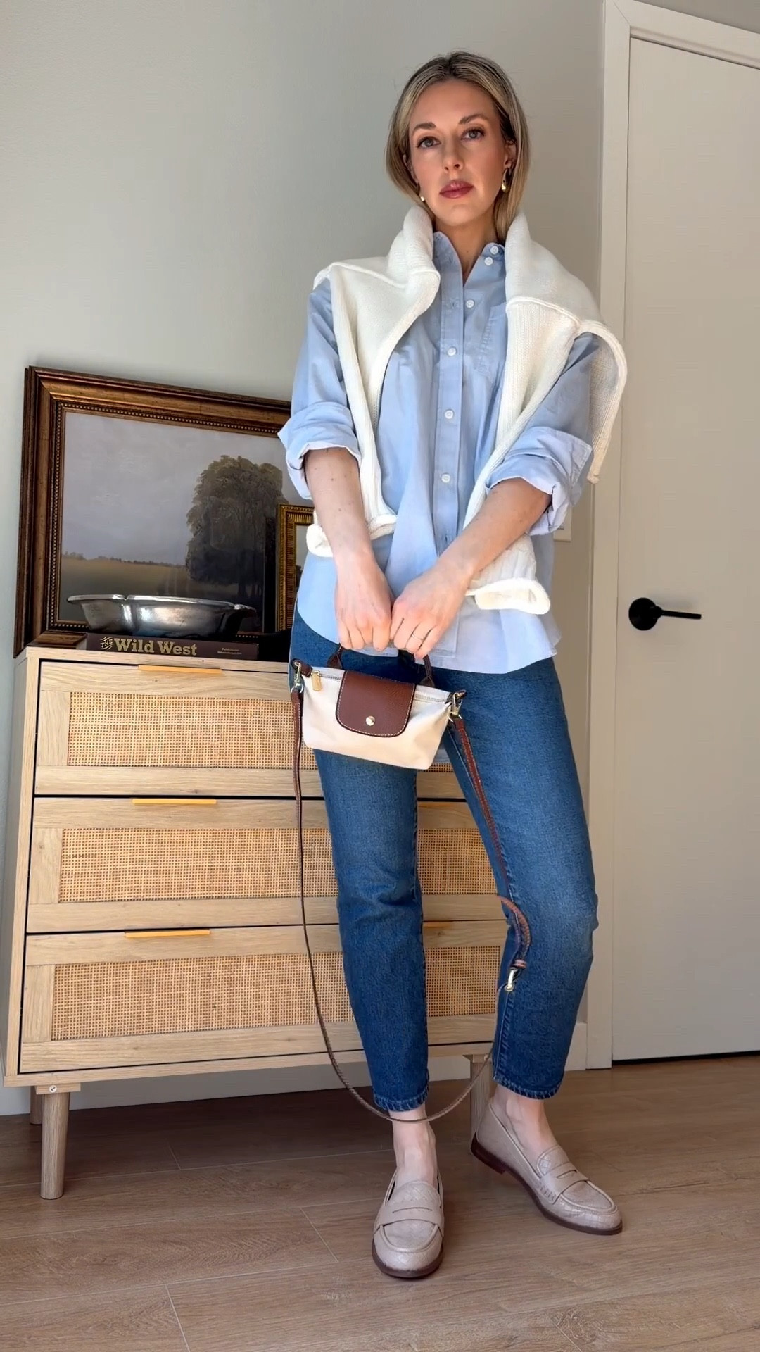 Effortless everyday style 🤍 A classic blue button-down layered with a cozy sweater, straight leg jeans, and neutral loafers for the ultimate timeless outfit. This look is perfect for work, casual meetings, weekend errands, or a matcha run in Silicon Valley. Sharing all the details including this structured mini crossbody, everyday perfume, and my favorite neutral lip.

If you love classic style, neutral outfits, capsule wardrobe pieces, and elevated basics, this is a go-to look you’ll wear on repeat.

Wearing size XXS in shirt 

#classicstyle #capsulewardrobe #neutraloutfit #everydaystyle #loafers #bluebuttondown #effortlessstyle #timelessfashion

#LTKootd