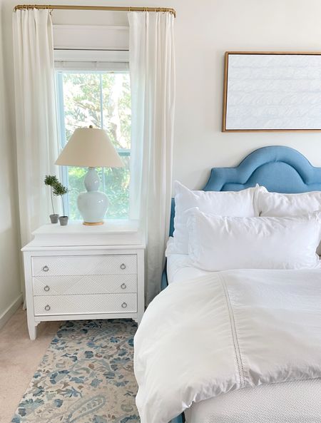 Our primary bedroom decor. 
White Nightstands 
Blue lamps
Upholstered bed
White duvet 
White bedding
Blue rug

#LTKsalealert #LTKhome #LTKstyletip