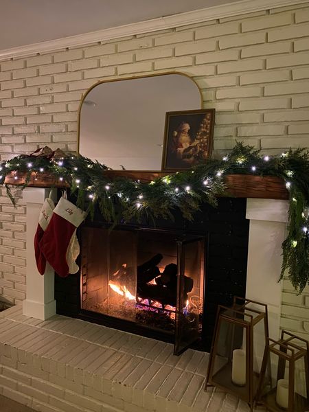 Christmas mantle decor, garland, Christmas lights, stockings, holiday art 

#LTKhome #LTKSeasonal #LTKHoliday