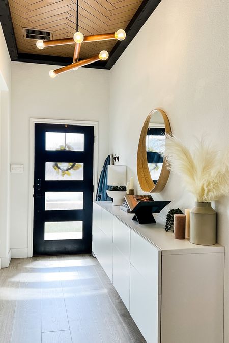 Our modern organic style entryway make for a very welcoming statement to our home. The black acrylic book stand, dried and faux plants, and warm, neutral decor make this room fit perfectly with the rest of our home.

#LTKhome #LTKunder50