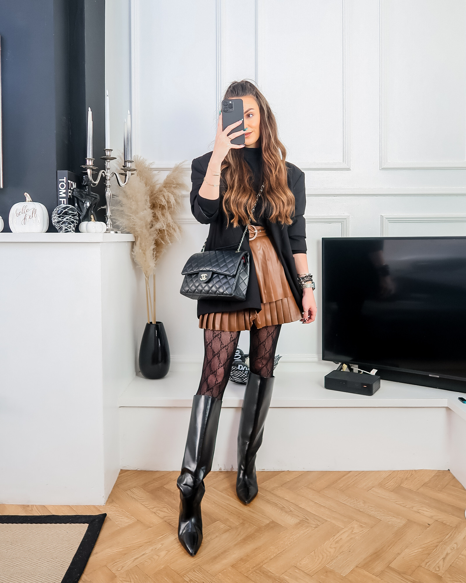 Brown leather pleated skirt, brown leather skirt, pleated leather skirt, knee high boots, pointed toe boots, black knit, black roll neck, black oversized blazer, autumn fashion, autumn outfit ideas, patterned tights, fashion tights, fall fashion, fall style, autumn style 

#LTKuk #LTKautumn #LTKeurope