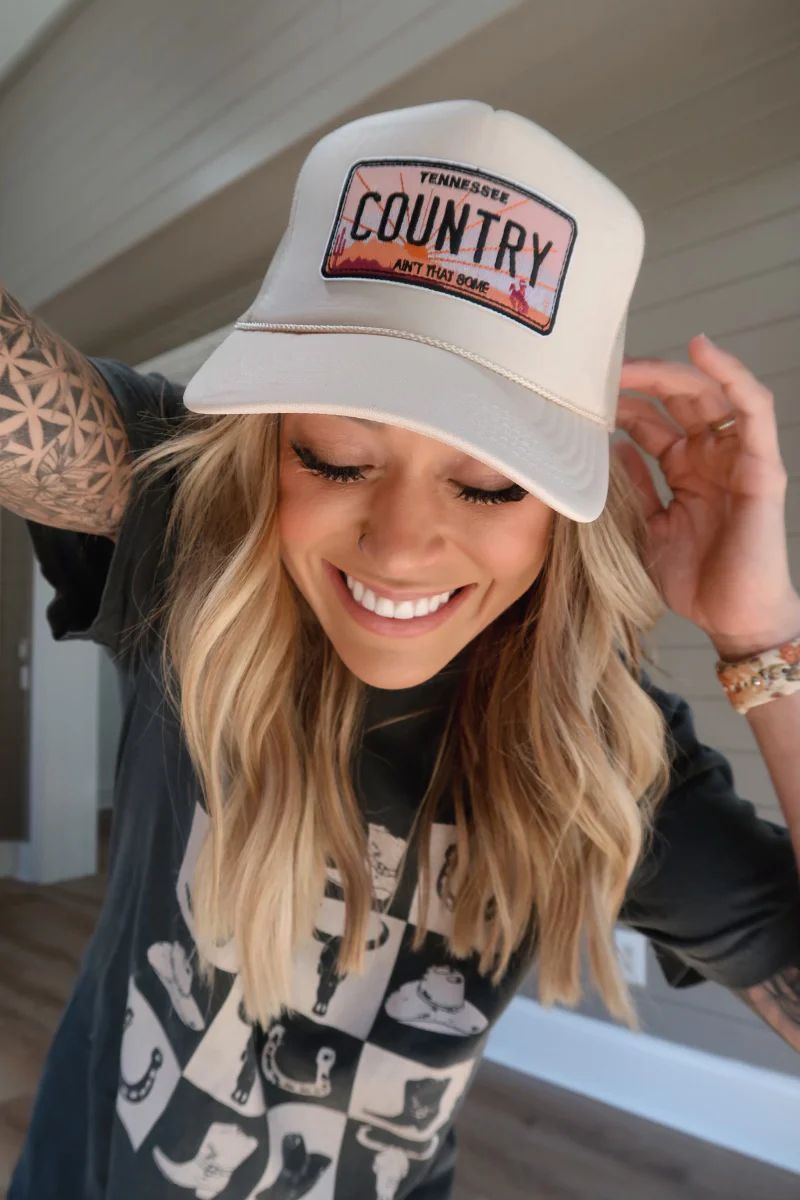 Country Ain't That Some Patch Tan Trucker Hat Holley Gabrielle X Pink Lily | Pink Lily