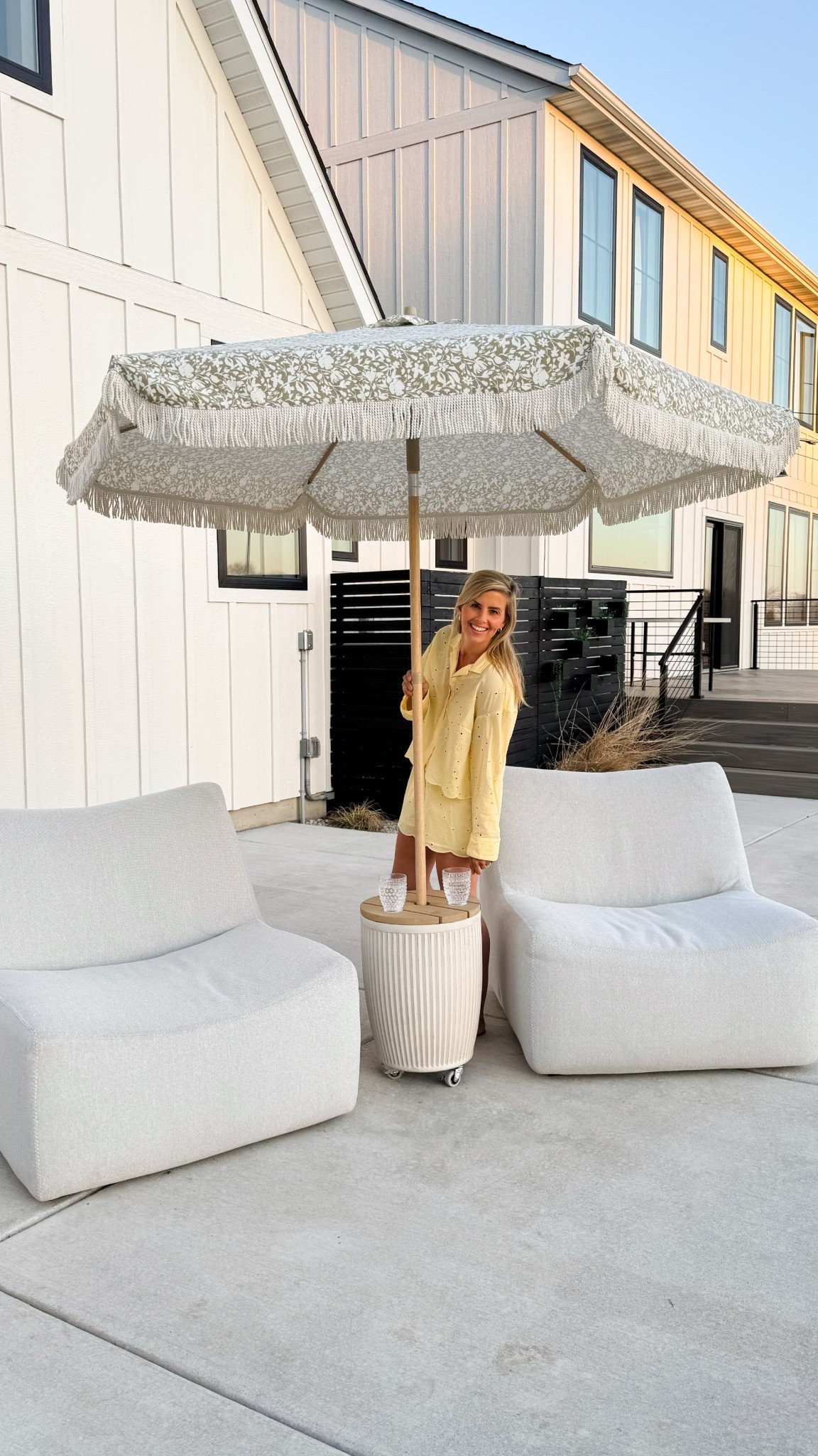 DIY ROLLING PLANTER UMBRELLA STAND & SIDE TABLE!
 We turned this simple planter into a beautiful umbrella stand using just a few simple materials—and the best part? It rolls!! Just 2 bags of concrete, some rubber casters, and a modern cedar wood top gave us the perfect combination of form and function! I love that I can easily move it around and without help! 

I linked the supplies below! The umbrella is beautiful, I love the floral & faux wood pole!

Ps. you can always skip the wood top for the umbrella stand and fill it with some faux greens, did you see that in the reel?? I love that look too!