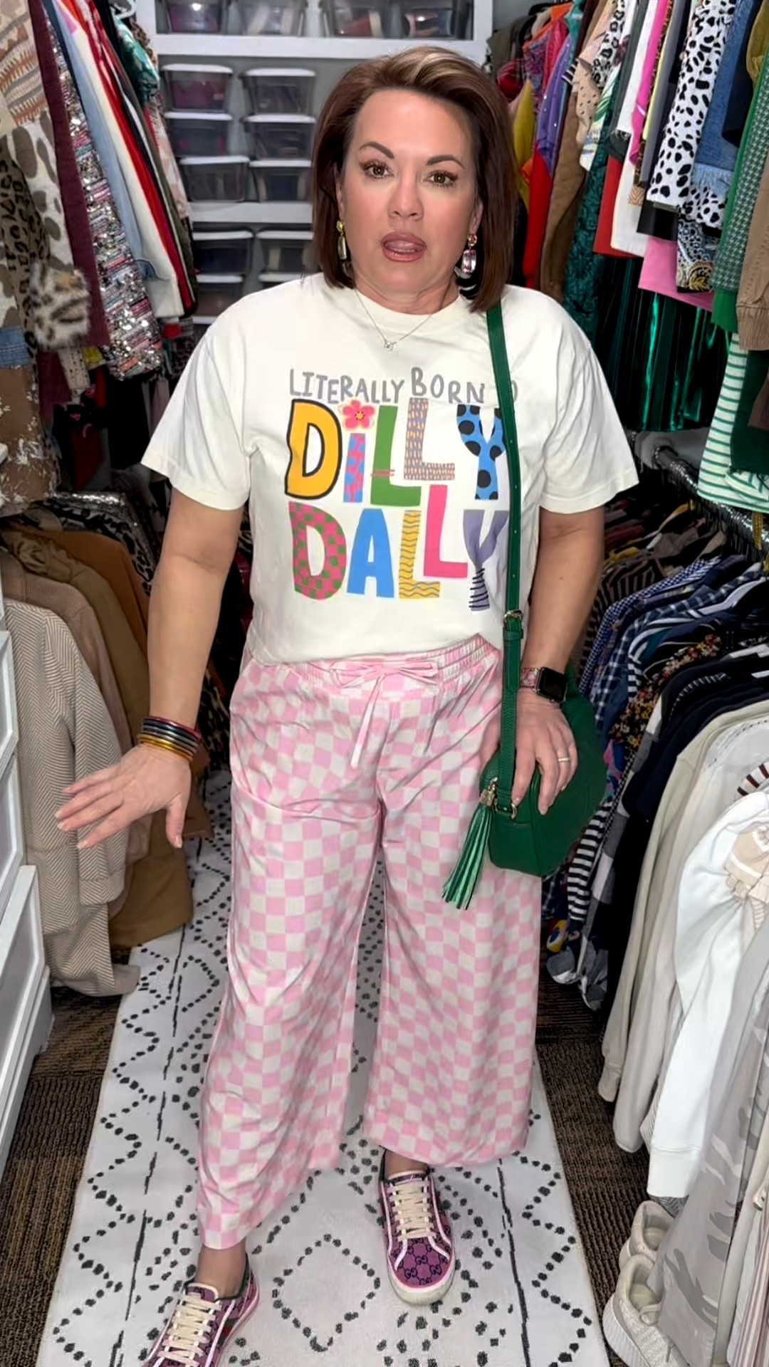 This is your sign to mix patterns and wear the fun pieces. Graphic tee plus pink checkerboard pants creates an easy, feel-good outfit that works for errands, casual days, and weekend plans.

The relaxed graphic tee balances the bold pants perfectly, while the green crossbody adds a pop of contrast that pulls everything together. This is one of those outfits that feels comfortable but still looks intentional, which is always my goal.

Everything is linked so you can recreate the look or mix it with pieces you already own.

graphic tee outfit, pink checkered pants, checkerboard pants outfit, casual graphic tee outfit, colorful casual outfit, fun everyday outfit, statement pants outfit, pattern mix outfit, pink wide leg pants, pink lounge pants outfit, casual statement pants, comfy printed pants, relaxed fit pants outfit, elastic waist pants, spring summer pants outfit, oversized graphic tee, neutral graphic t shirt, casual cotton tee, graphic tee styling, everyday graphic shirt, green crossbody bag, quilted crossbody purse, tassel crossbody bag, statement handbag outfit, casual outfit accessories, casual sneakers outfit, designer inspired sneakers, everyday walking shoes, fashion sneakers outfit, spring casual outfit, summer casual outfit, weekend outfit ideas, mom casual outfit, errands outfit idea, comfortable everyday outfit, casual chic outfit, playful fashion style, bold color outfit, over 40 casual style, over 50 casual fashion, Amazon casual outfit, affordable statement pants, comfortable fashion finds, casual outfit inspiration, fun fashion for women


#LTKOver40 #LTKActive #LTKFindsUnder50