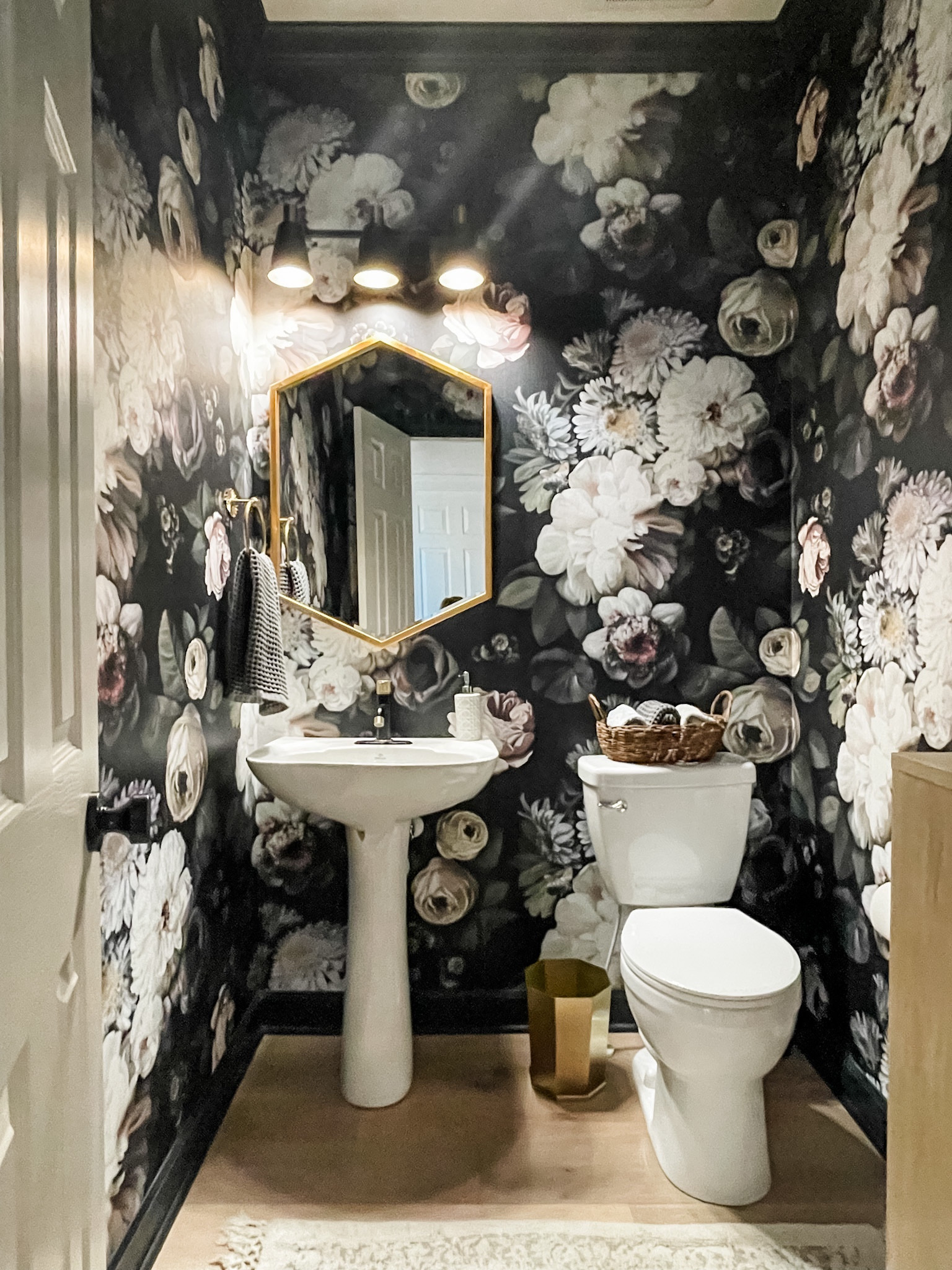 Moody, bold wallpaper combined with sleek lines in black and brass create a statement making powder room. 
#bathroomdesign #bathroomdecor #wallpaper

#LTKhome
