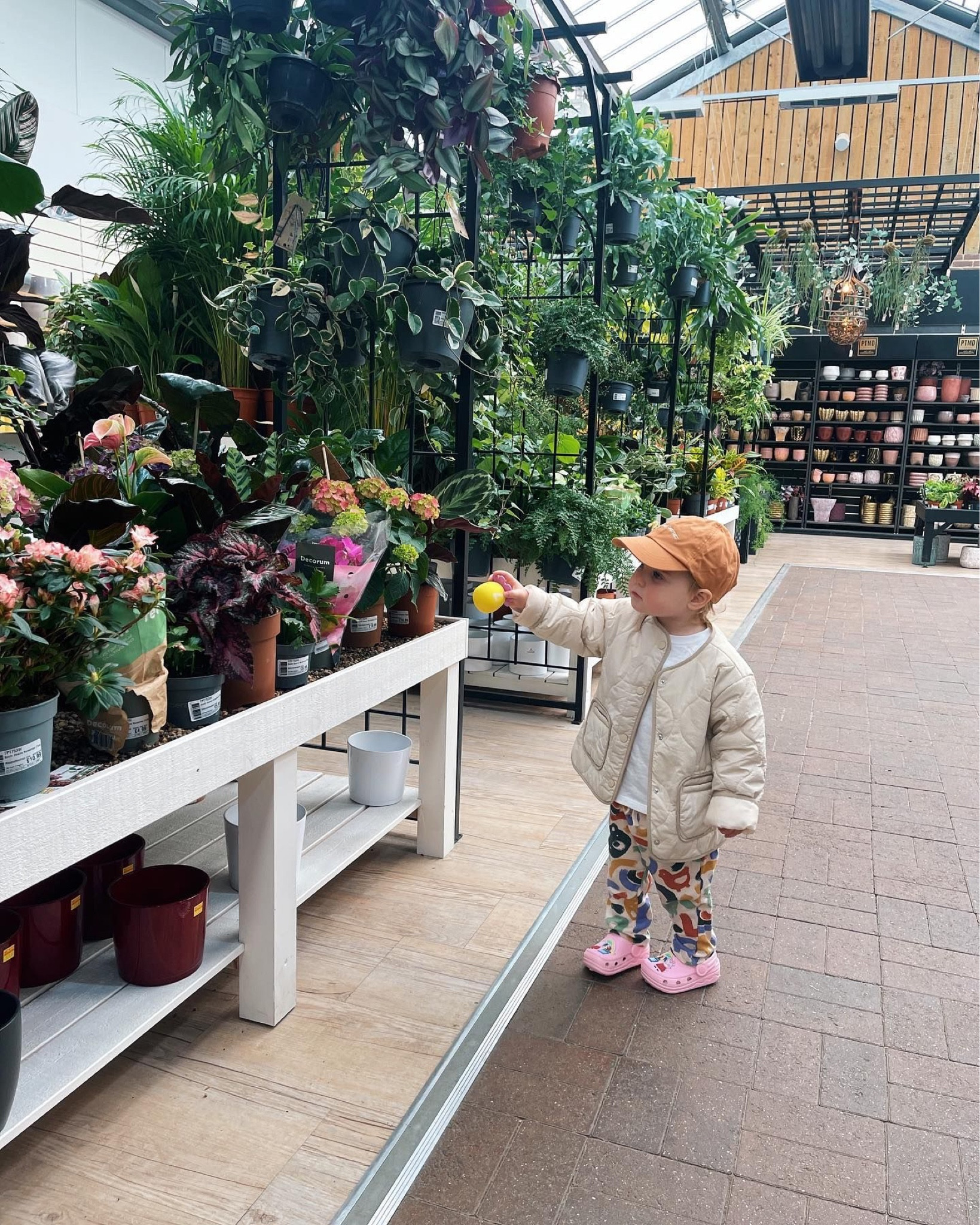 Beige kids jacket, cute raincoat, spring jacket, kids crocs, orange cap, garden center, paint stroke patterned trousers, animal cartoon pattern pants, kidswear 

#LTKkids #LTKfamily #LTKeurope