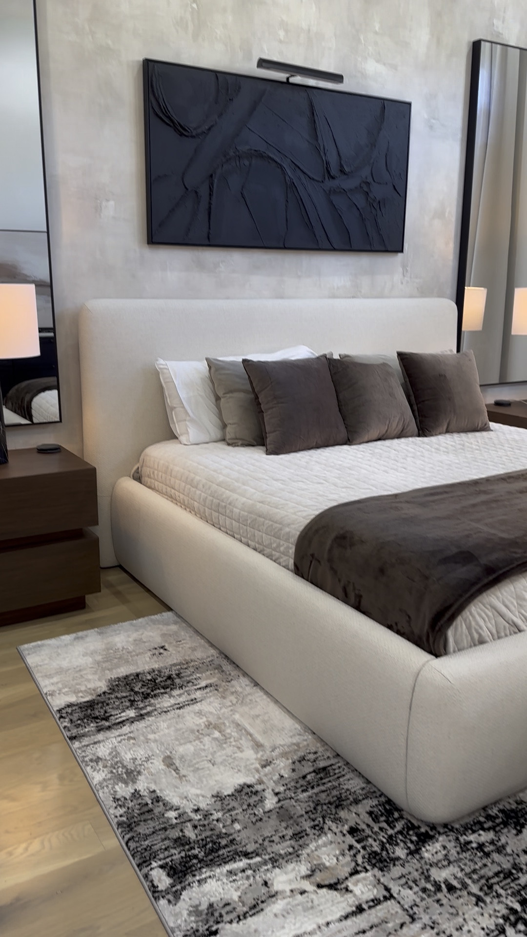 Modern neutral luxury bedroom design decor, ivory platform bed, marble lamps, abstract rug, velvet brown pillows, black abstract canvas art, floor to ceiling curtains

#LTKHome #LTKStyleTip