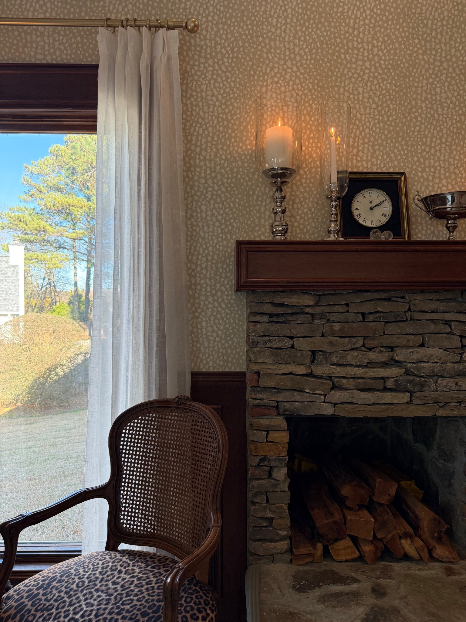 This mantel is all about classic balance and soft glow. I anchored the vignette with hurricane candlesticks, layering different heights to create warmth and a timeless, Ralph Lauren–inspired feel. Hurricanes are one of my favorite styling staples. They instantly elevate a space, add ambiance, and work year-round.

Paired with traditional accessories and natural textures, this setup feels collected and intentional without being overly styled. It’s proof that a few classic pieces, repeated thoughtfully, can make a big impact.

#LTKHome #LTKSaleAlert