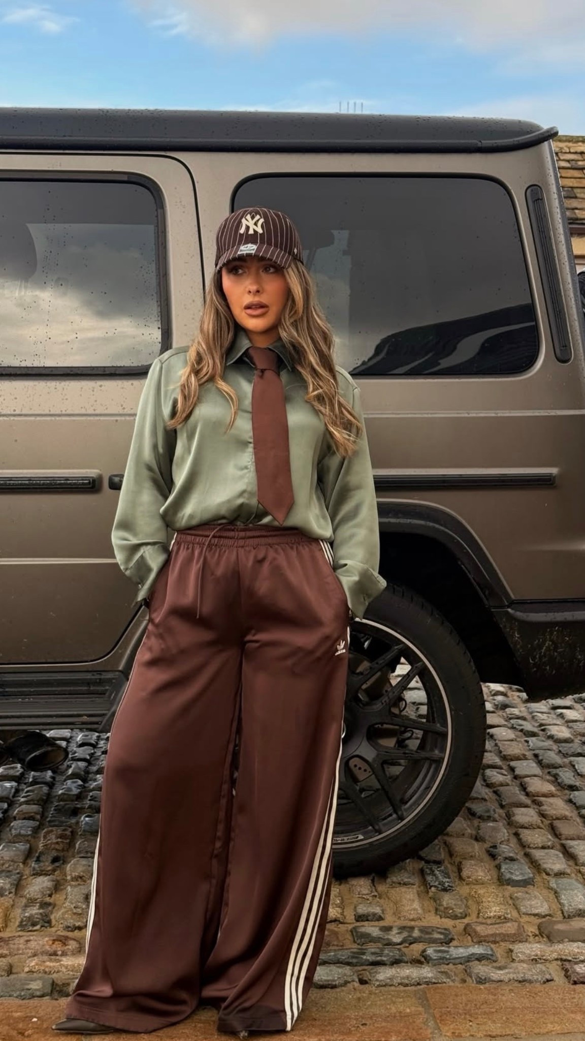Cool girl look - brown adidas trousers - tie shirt 

#LTKFashionMonth #LTKspring #LTKstyletip