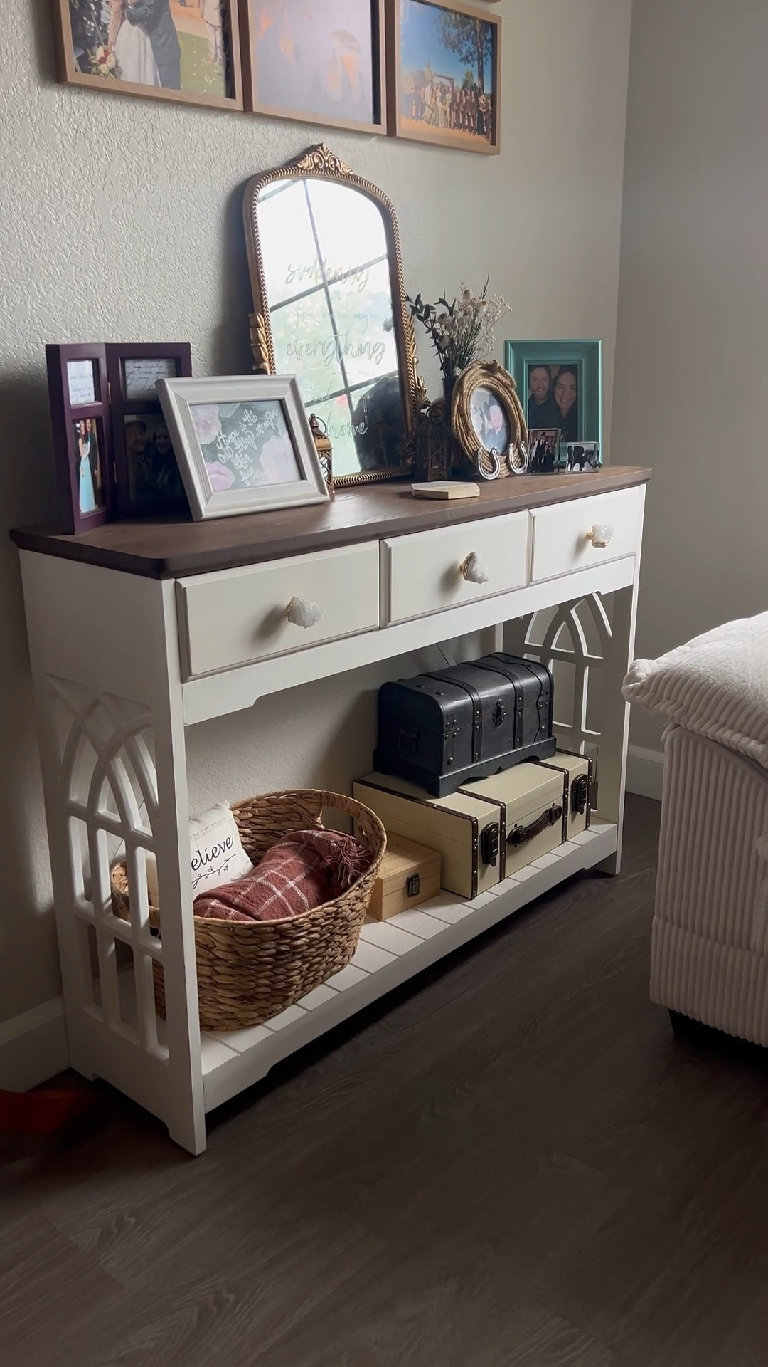 Console table with catherdral window detailing. I switched out the knobs for clear quartz crystal knobs and we love it. 