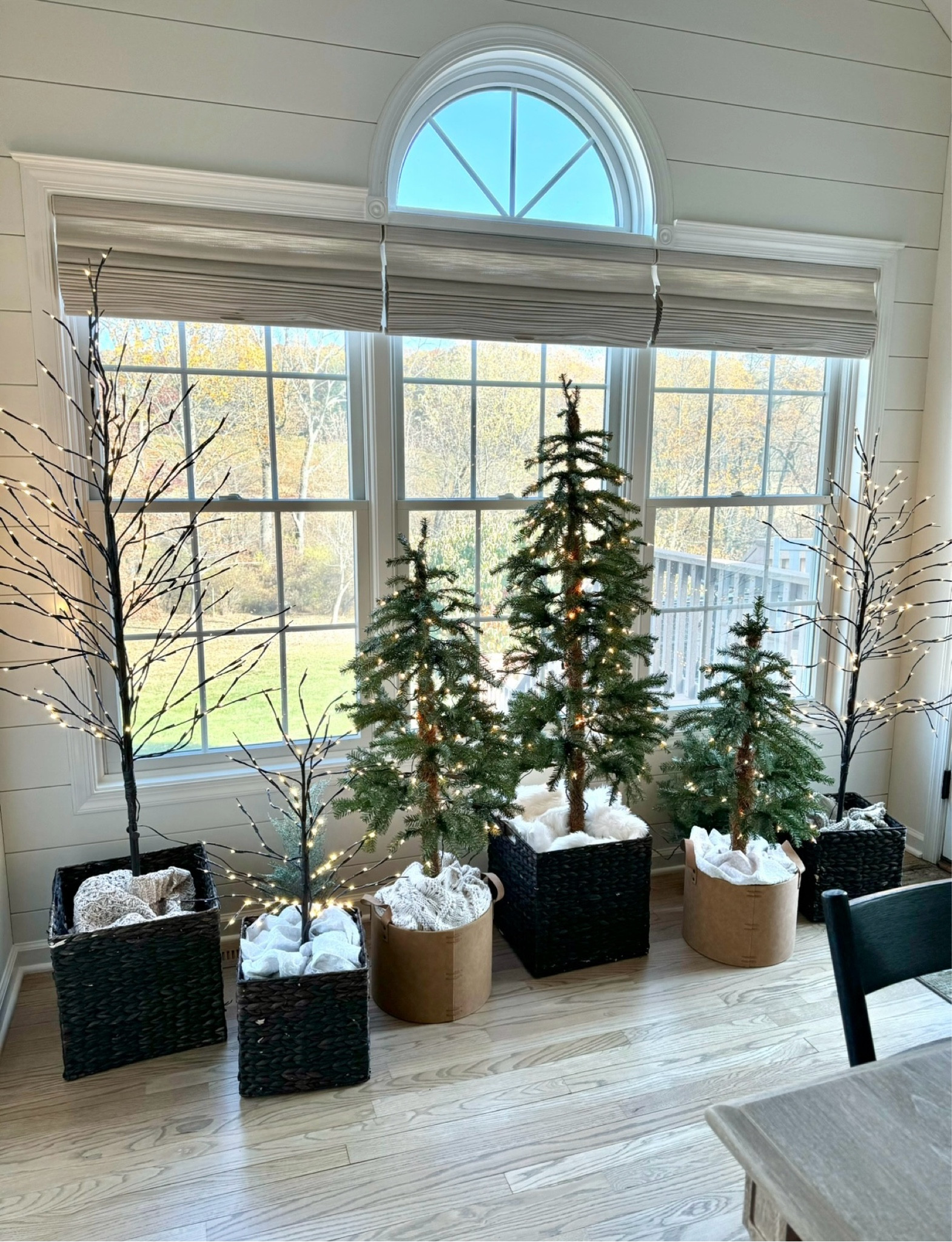 The trees on both ends of the windows are my set-of-3 brown twig trees. The pre-lit Hickory Cedar trees in the center are sold individually. They all add lots of pretty sparkle to your Christmas home without taking up much space. Also shown are the two different types of baskets I put the trees in for a more elevated look. 🎄

#LTKHome #LTKHoliday #LTKSeasonal