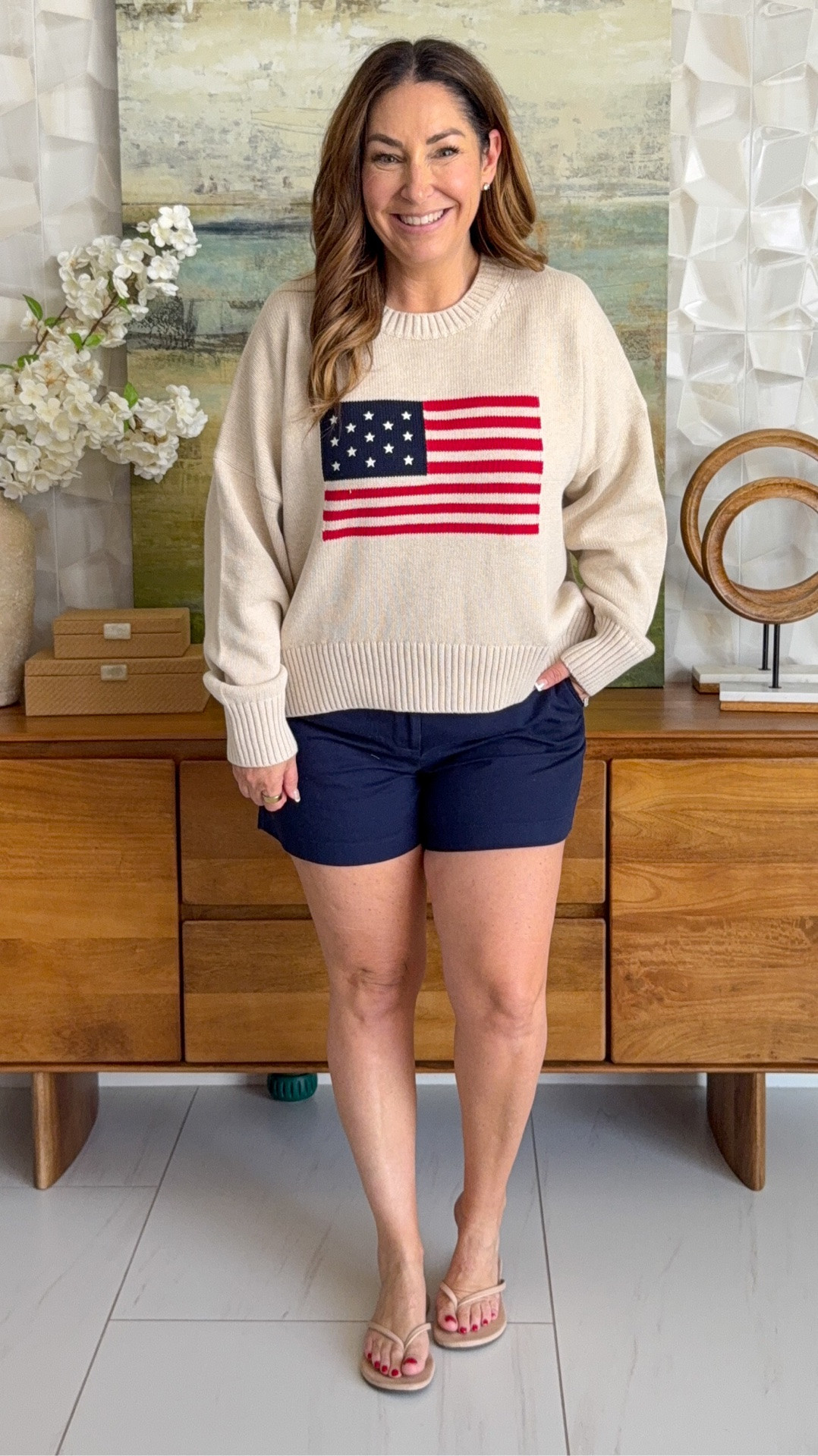This Quince flag sweater is so good 🇺🇸 Lightweight enough for summer nights and under $50. Paired with classic navy shorts — a perfect patriotic look for Memorial Day, 4th of July, or any summer gathering.

Wearing a large in sweater, size 12 in shorts
5'5 / size 12 for reference 

 
