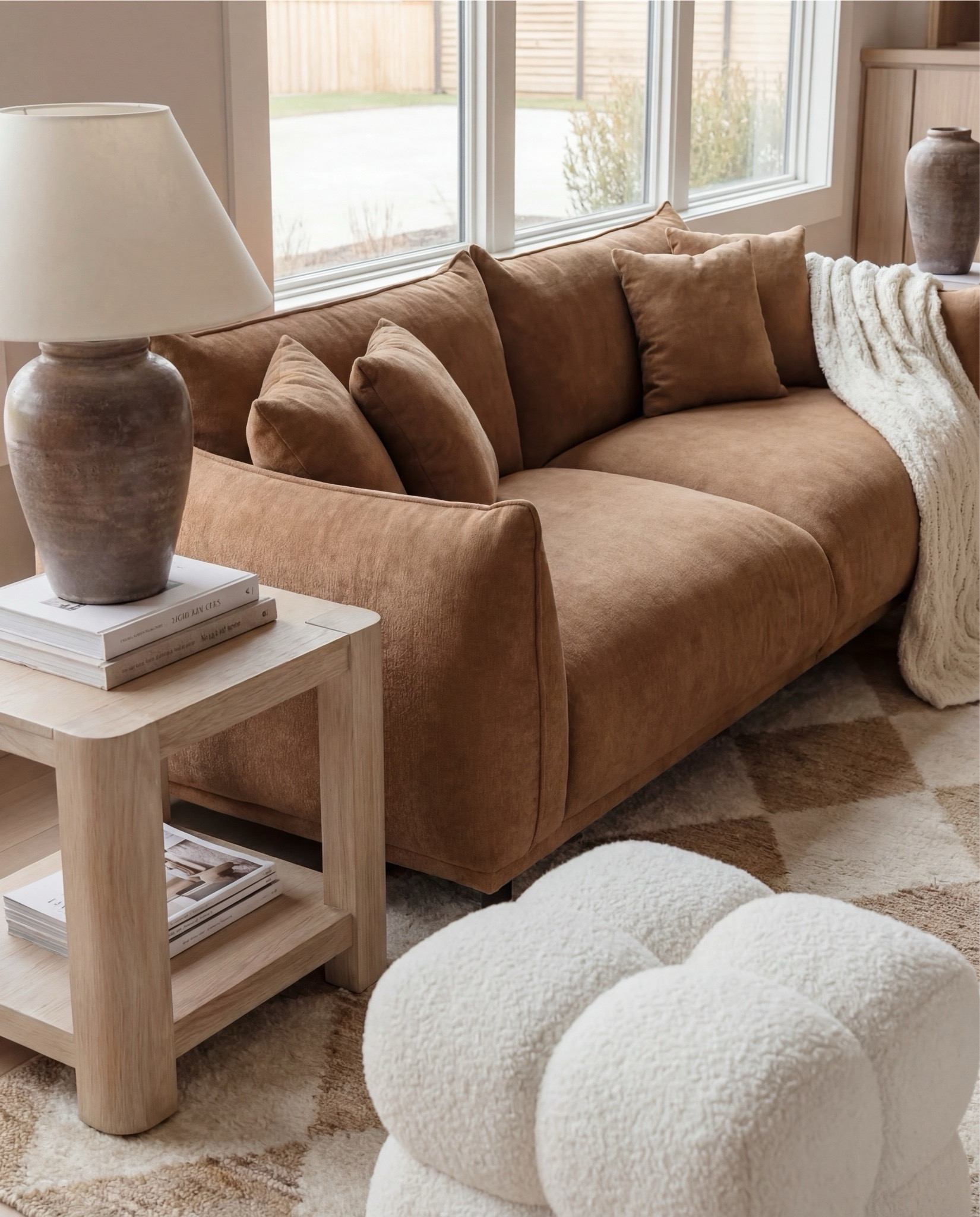 ✨ Shop the look:
Caramel boucle swivel chairs | Caramel curved sofa | Plush square boucle ottomans | Neutral diamond-pattern rug | Light natural wood nesting coffee tables | Stone-look ceramic vases | Light oak built-ins | Dramatic brown-veined marble fireplace | Exposed oak ceiling beams | Glass globe pendant . White boucle ottoman 

#LTKHome #LTKSaleAlert