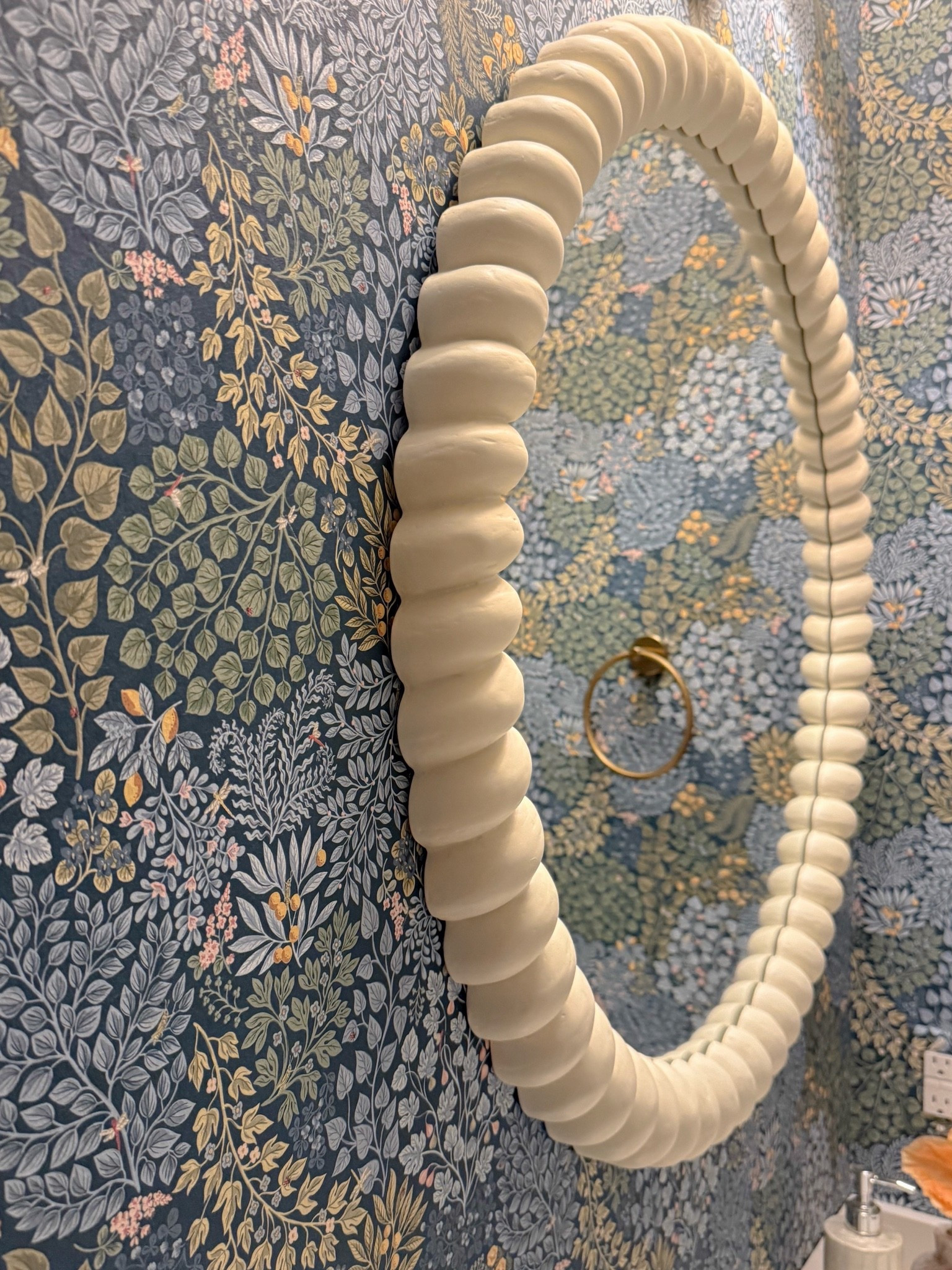 This mirror is basically artwork for the wall. The sculptural frame adds so much dimension against the floral wallpaper and gives this little powder room even more personality.

statement mirror, bathroom mirror, scalloped mirror, powder room decor, floral wallpaper, bathroom decor, wall mirror, statement decor, bathroom inspiration, colorful home, girlonthehudson

#LTKHome #LTKSeasonal #LTKdayinmylife