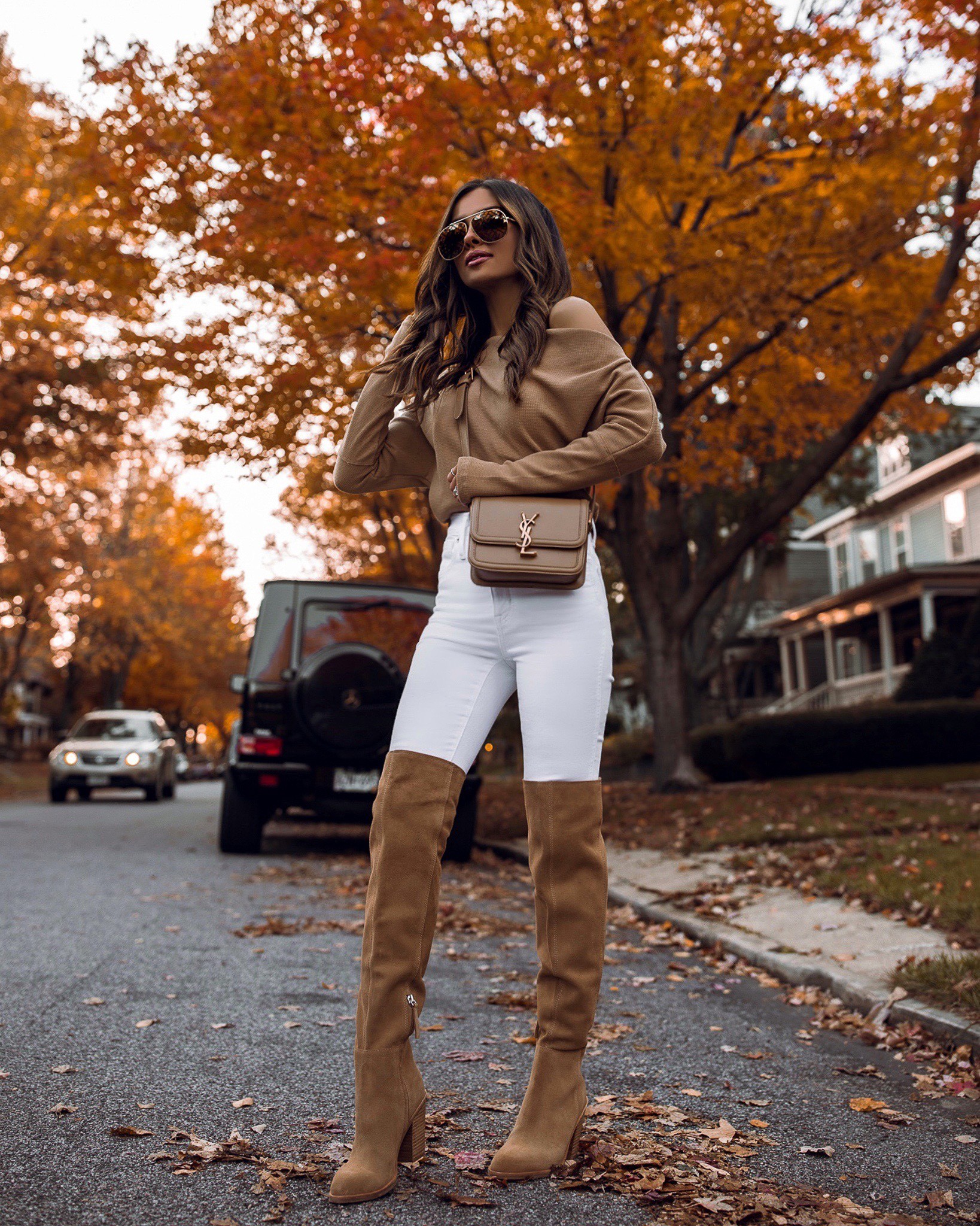 Free People camel top on sale now! Wearing an XS
Madewell white denim wearing a 24
Suede boots 



#LTKunder100 #LTKsalealert #LTKstyletip