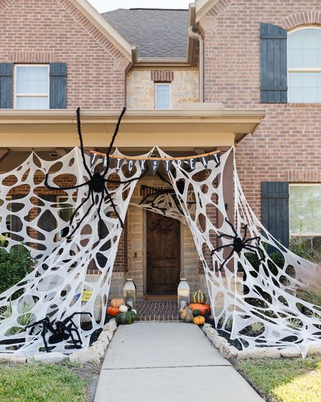 Our Halloween porch decorations with DIY beef netting spider webs and large spiders



#LTKHalloween #LTKhome