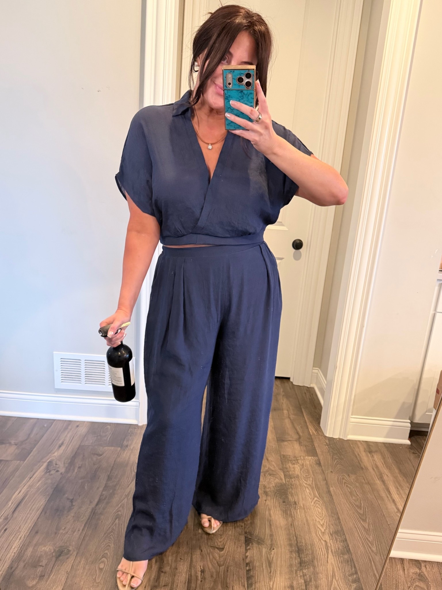 I have this set in white, black, navy. I love wearing the white and black top separately too (see other examples in LTK) I am in true size, XL. Runs a little long. Breezy, barely wrinkles. Under $50.