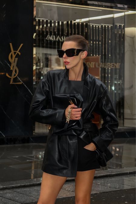 - Black leather jacket
- Oversize ysl sunglasses
- Black pouch clutch bag Victoria Beckham

#LTKeurope