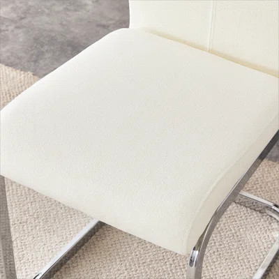 Luxury - style Dining Chairs. Comfort & Stability in One.The combination of white grainy fabric-like fabric and silver metal legs is stylish and versa | Wayfair North America