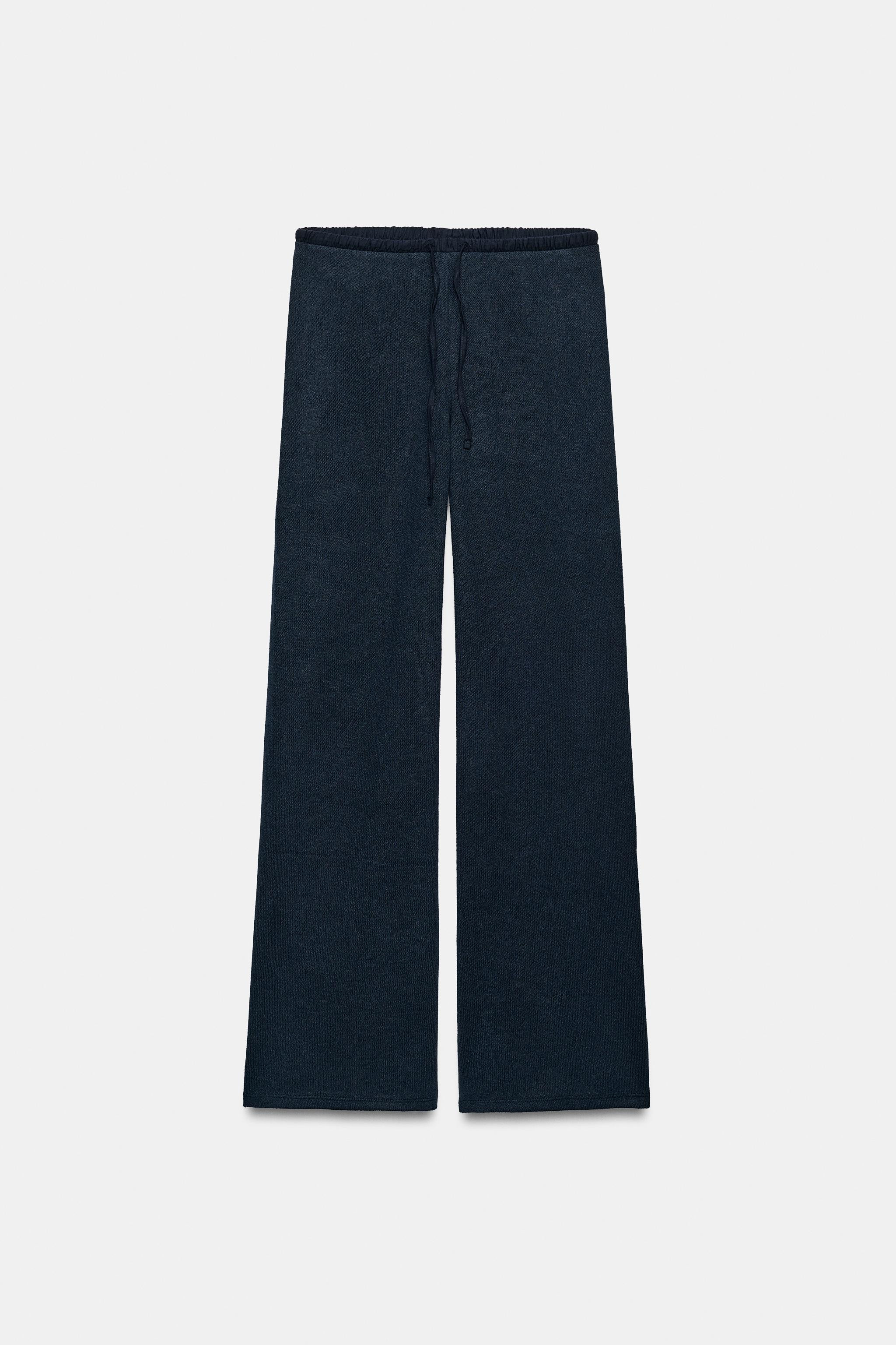 Model height: 173 cmTrousers made from a viscose blend yarn. Featuring a mid-waist, an adjustable... | Zara UK