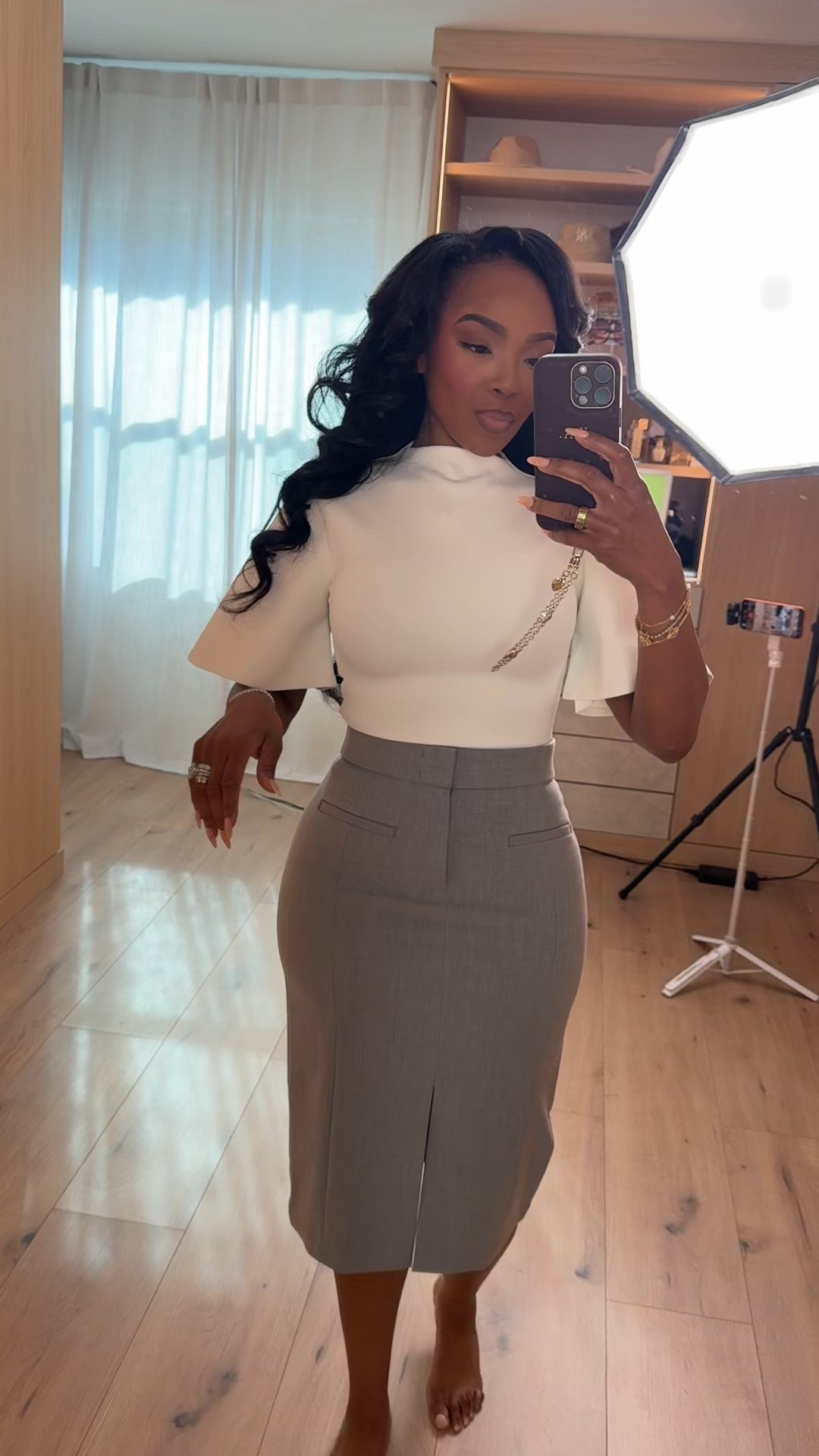 Polished and powerful in the Heiress top 🤍  
@Spanx 
This is that elevated workwear combo that hugs in all the right places. The structured Heiress top gives shape through the shoulders and waist, while the @Spanx pencil skirt smooths and sculpts for a clean, tailored silhouette. It’s classic, feminine, and flattering — the kind of outfit that makes you stand a little taller. And because both pieces mix effortlessly with your wardrobe staples, the cost per wear is worth it.

Soft structure up top. Sculpted perfection on the bottom.

Perfect for:
• Office days  
• Important meetings  
• Networking events  
• Church  
• Dinner after work  

📏 Sizing:  
Heiress Top: X Small  
@Spanx Skirt: X Small  

📐 Measurements:  
5’4” · 138 lbs · 34D bust · 27” waist · 40” hips  

Tap to get details and favorite to revisit later — this combo is a forever staple.

White structured top women, Spanx pencil skirt outfit, chic office outfit women, business professional style, sculpting midi skirt, polished feminine workwear, neutral capsule wardrobe pieces.

Follow me on Instagram and YouTube @kirasfashionfinds
