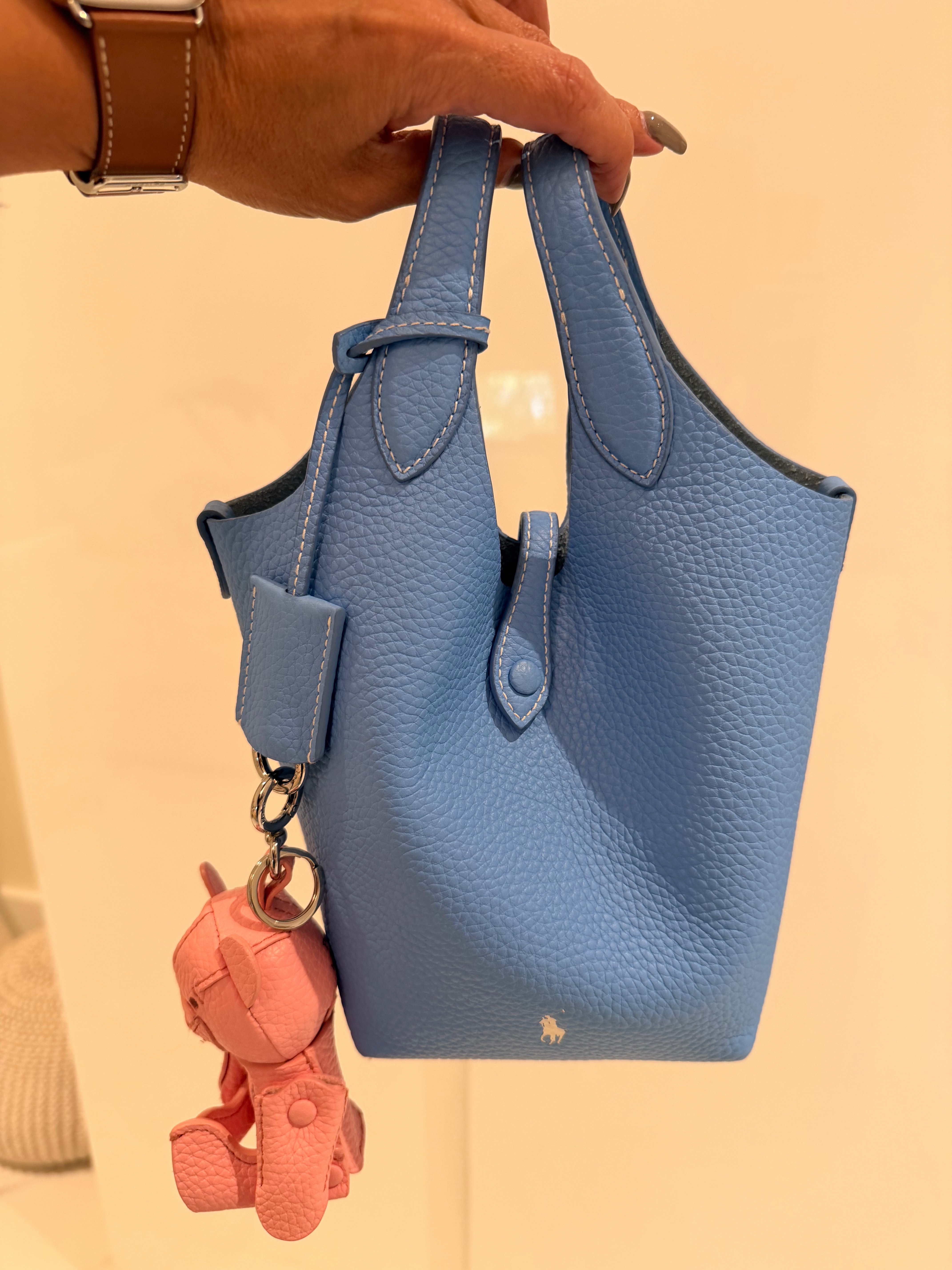 How cute are these bucket bags from Polo by Ralph Lauren. Adding a pop of color with these playful mini bags never look so chic. Available in Many Colors and also they come with removable strap for a crossbody option. 

 #LTKgrwm #LTKootd #LTKSeasonal