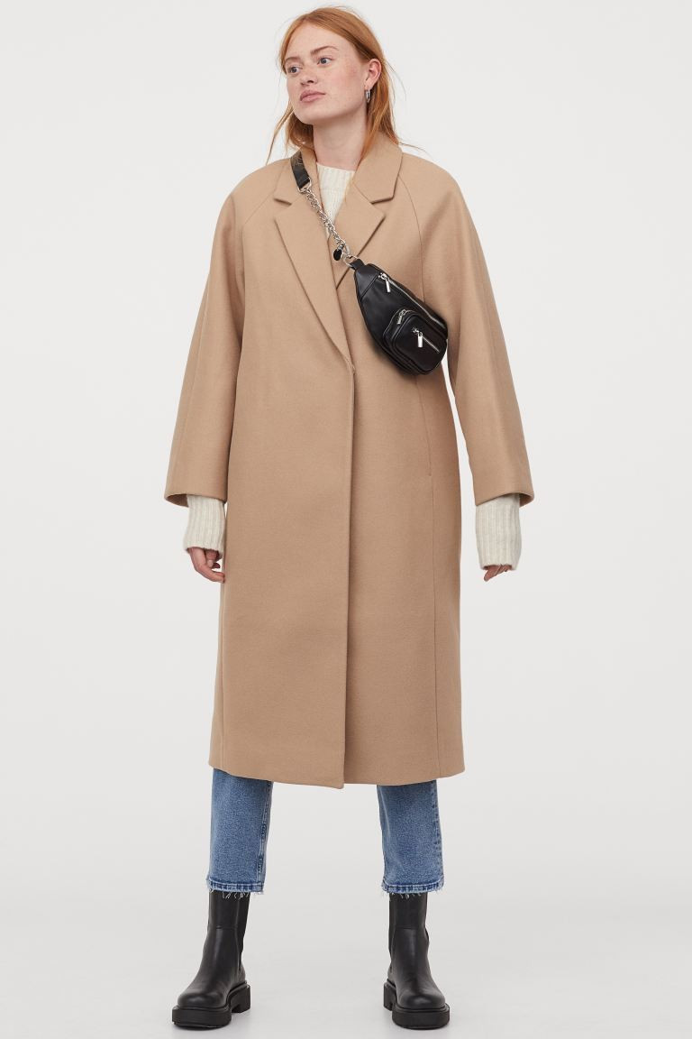 Calf-length coat in woven fabric. Notched lapels, concealed snap fasteners at front, and discreet... | H&M (US + CA)